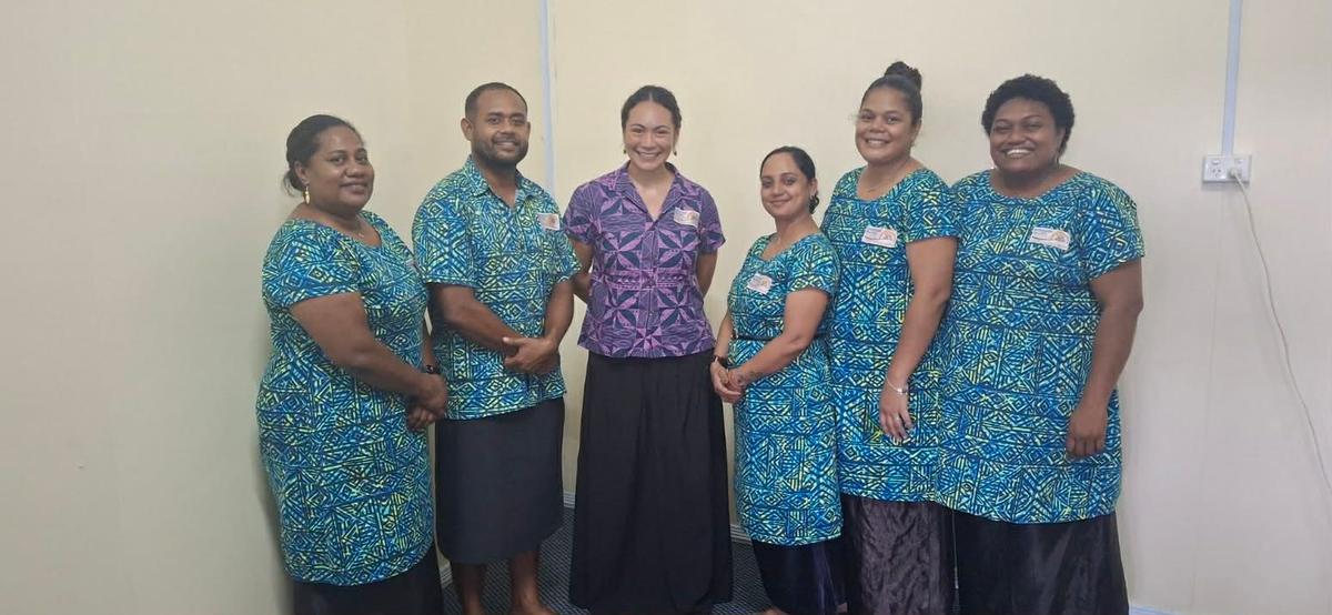 A group of people smiling for the camera