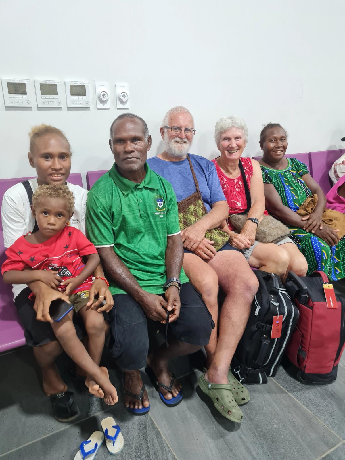 A group of people smiling for the camera.