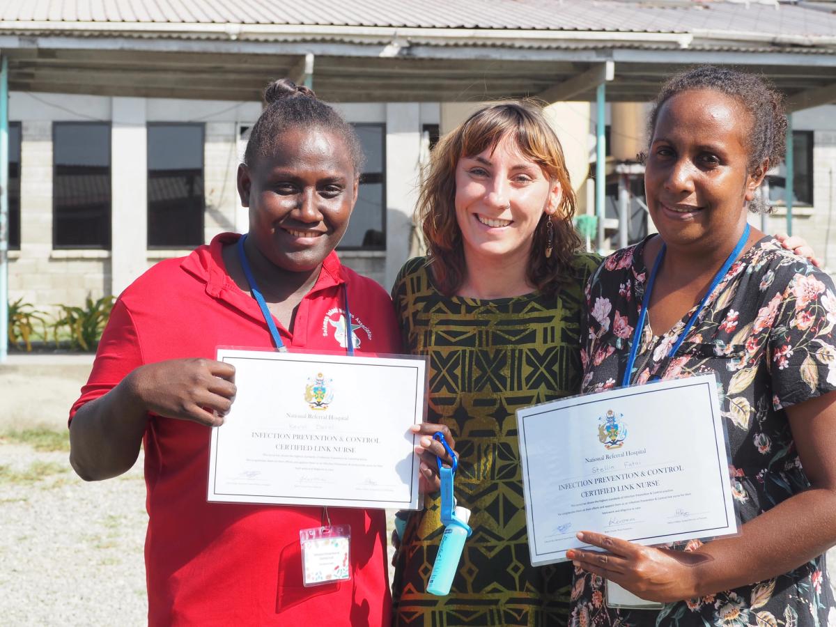 Three women smiling for the camera
