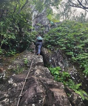 Gemma climbing up Raemaru