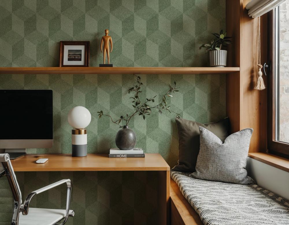 a photo of a home study room with green patterned cube themed wallpaper