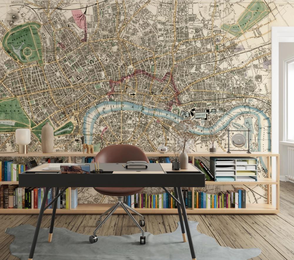 a photo of a home office with a vintage map of london themed wallpaper