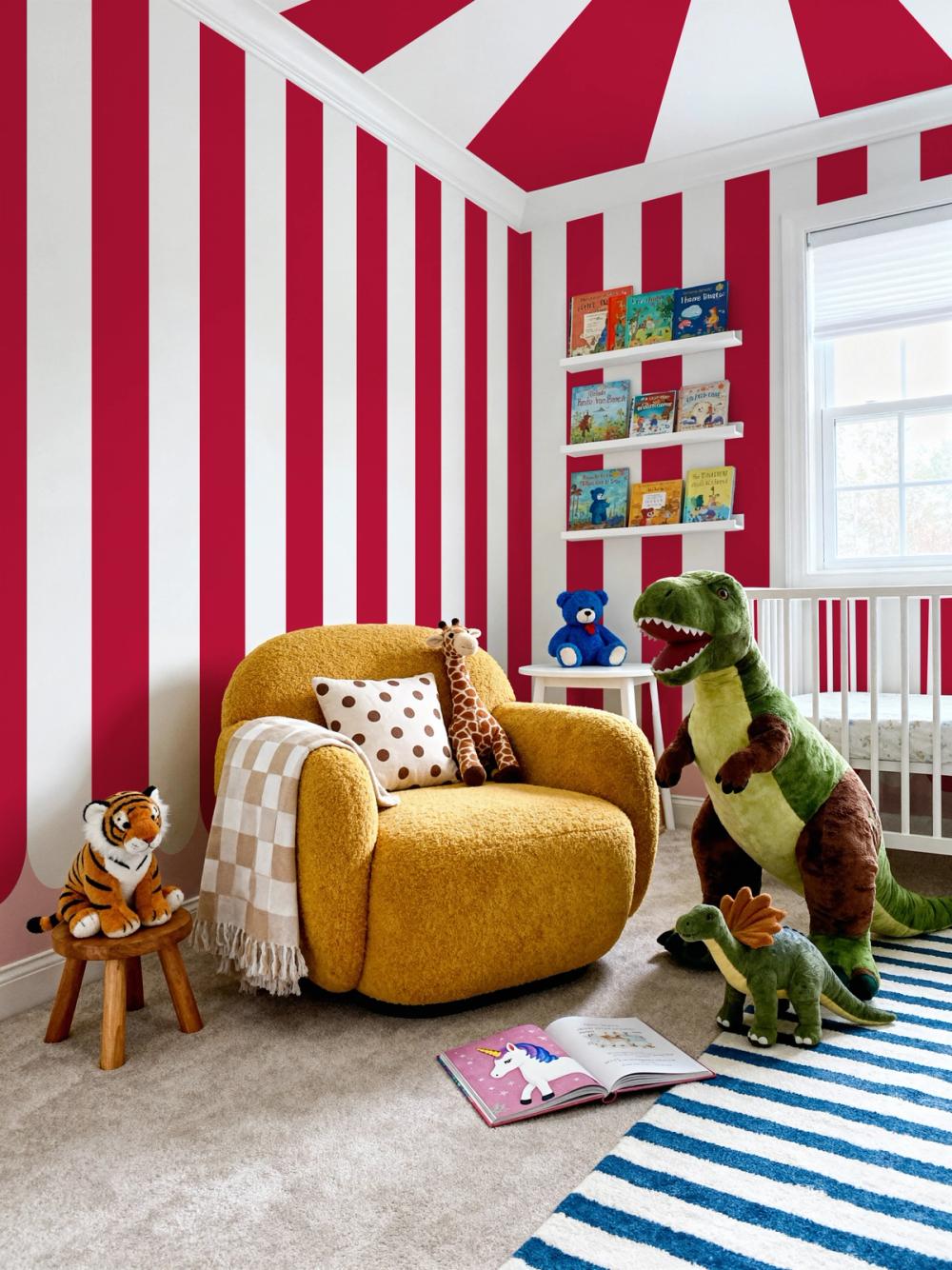 A photo of a kids playroom with red and white striped wallpaper on the walls