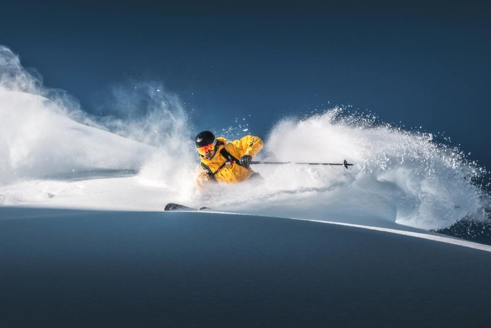 photo of skier carving fresh POW!