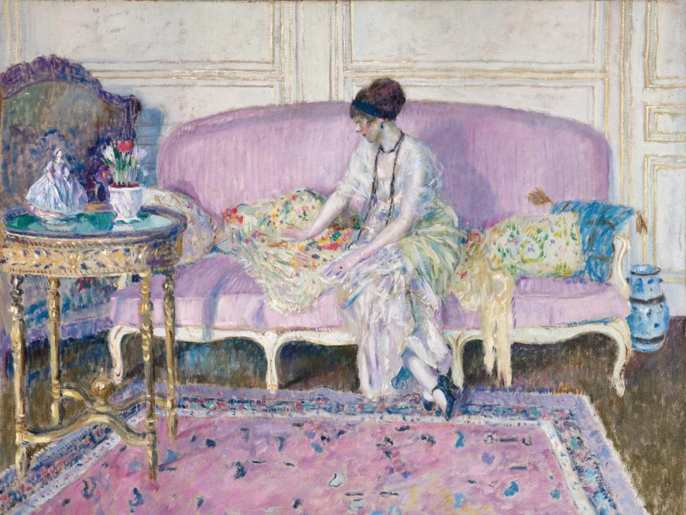 Woman Seated on Interior Sofa