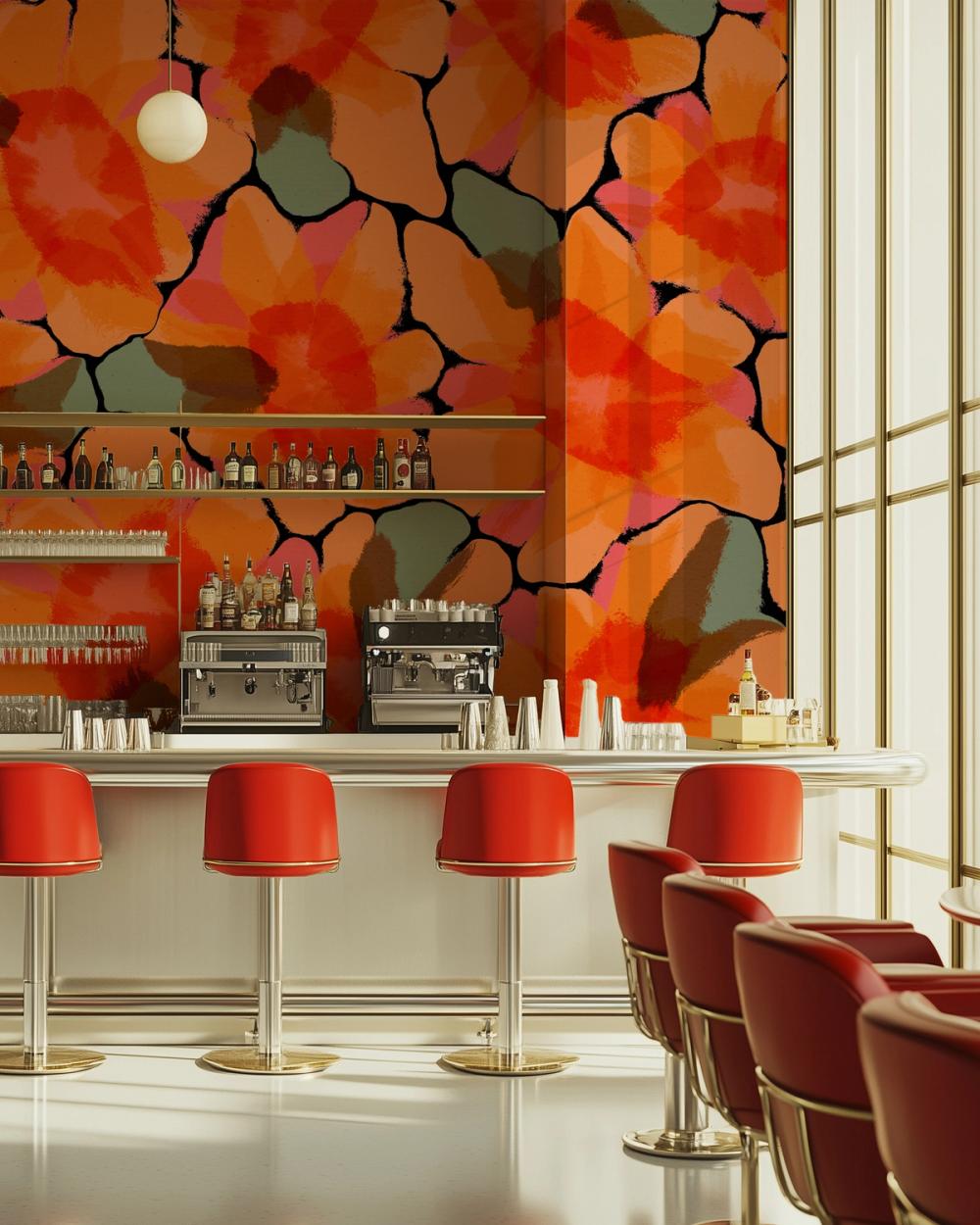 an interior photo of a bar with bright red and orange wallpaper behind the bar