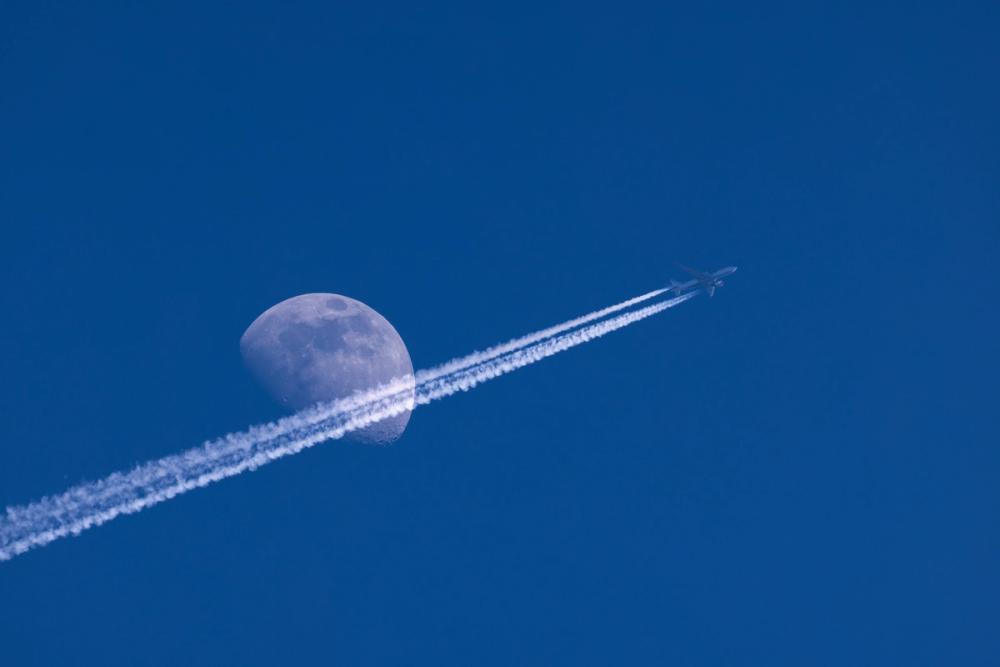 Airplane Trails and Moon
