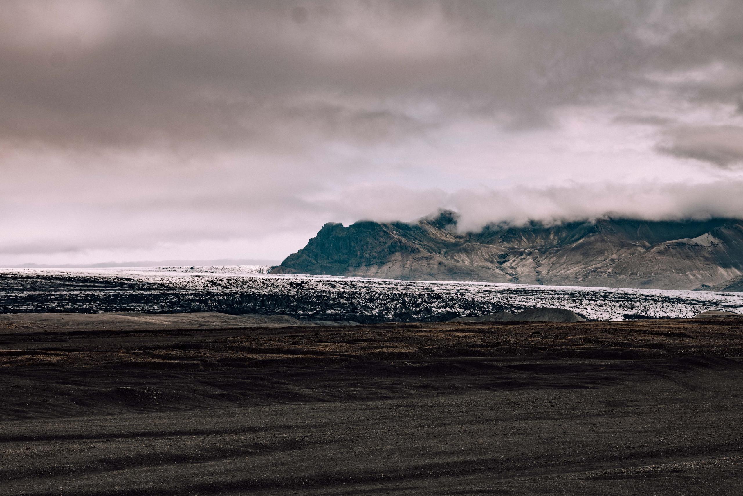 Landscape of cloudy Iceland black terrain