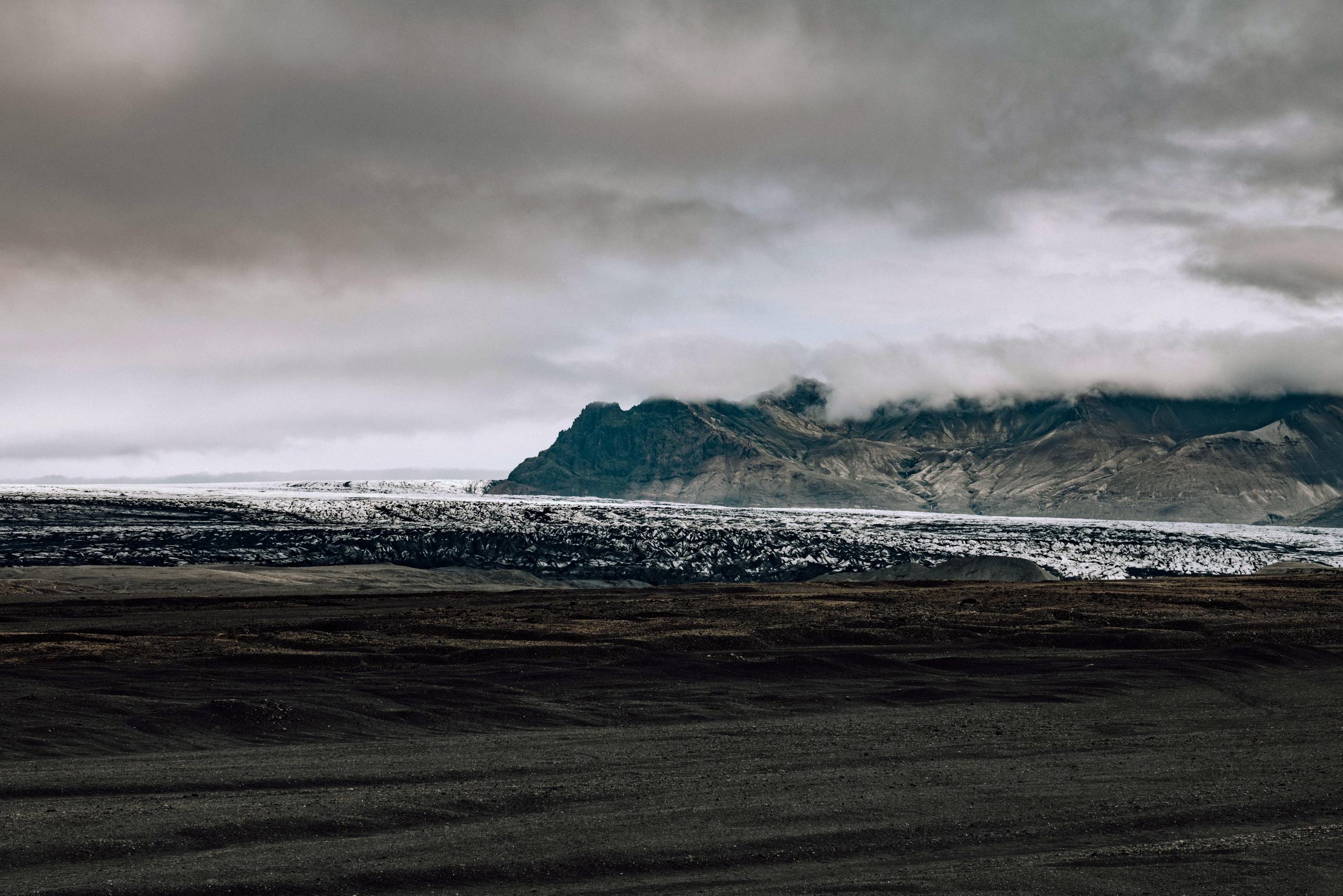 Iceland landscape of glacier's edge with mountains in the background