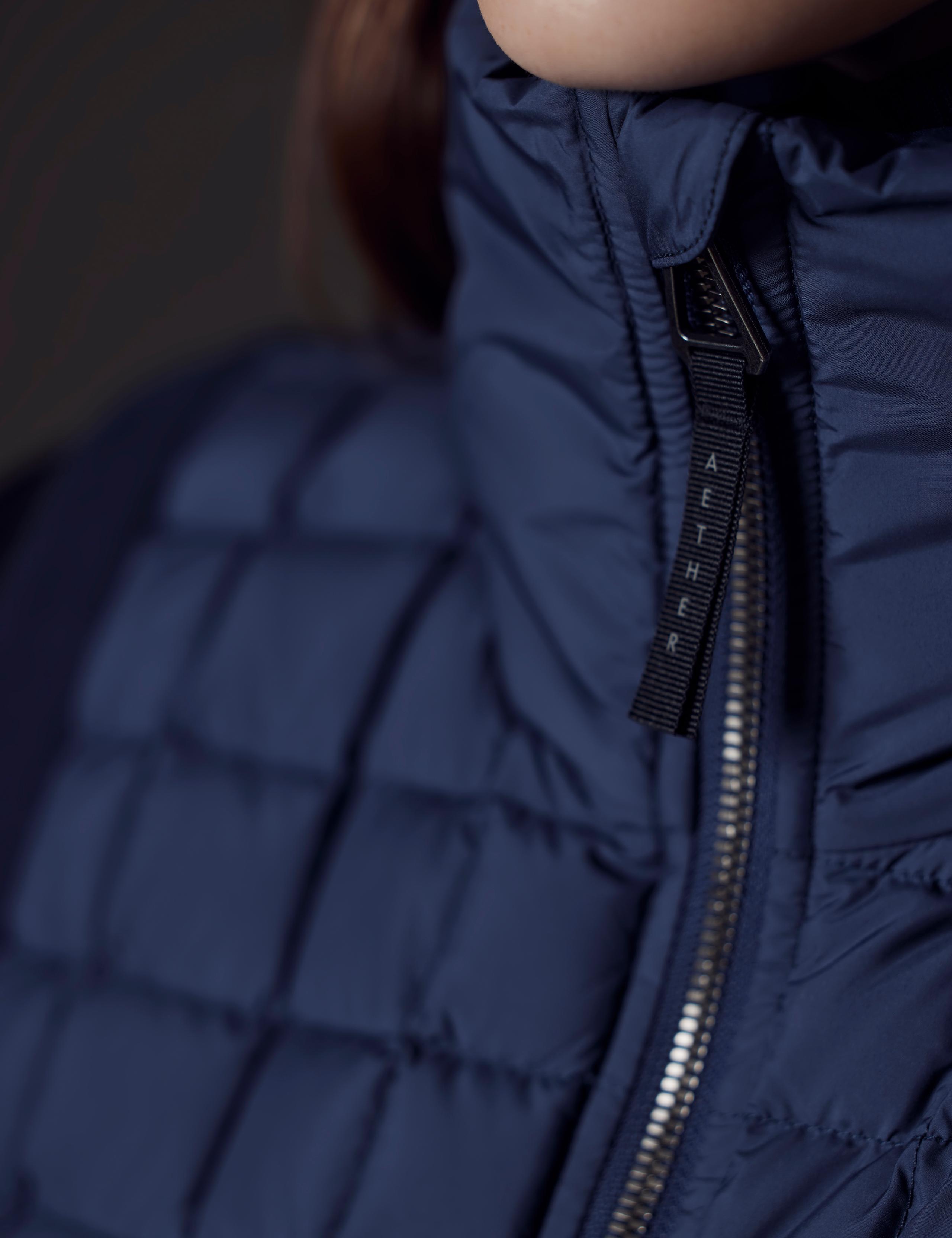 Detailed shot of Phase Zip front zipper and chin.