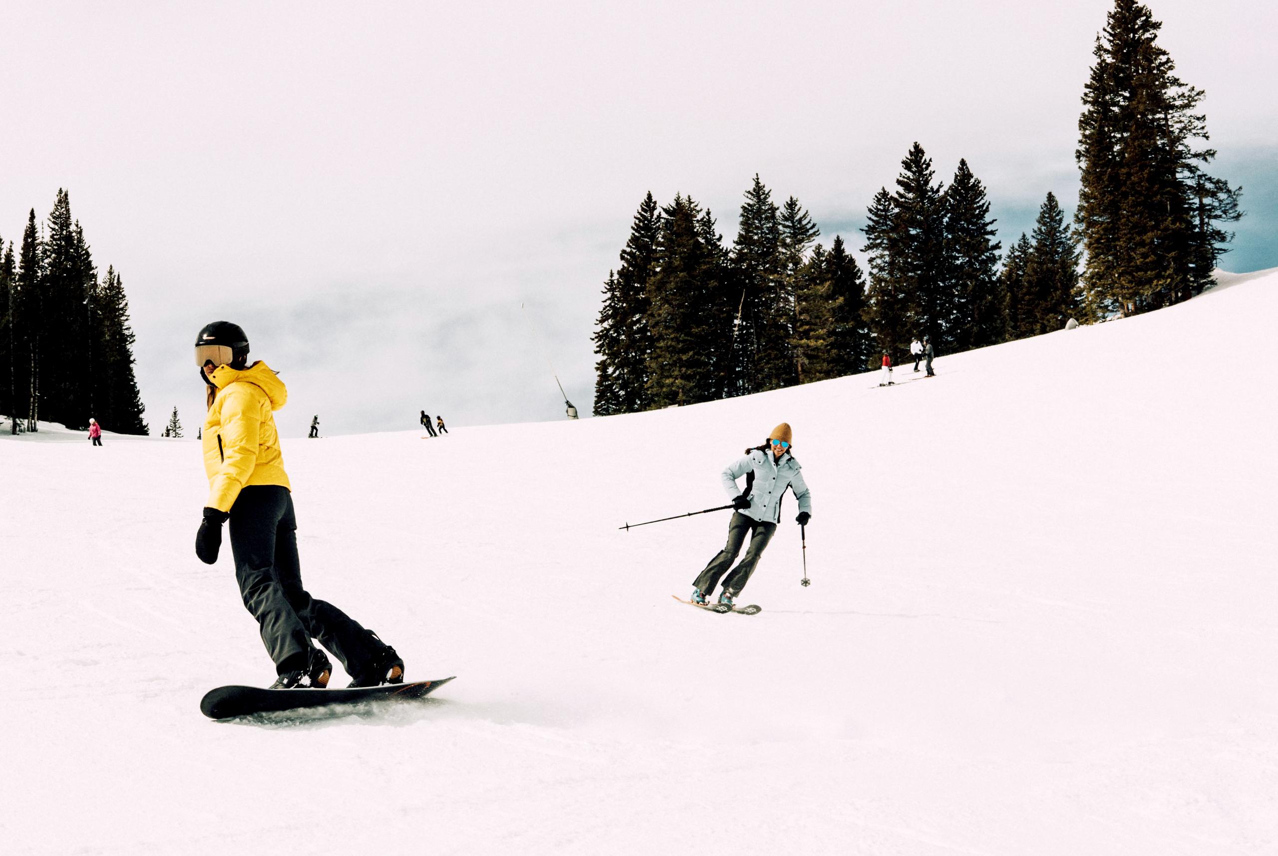 Women in W Torino Jacket skiing down hill