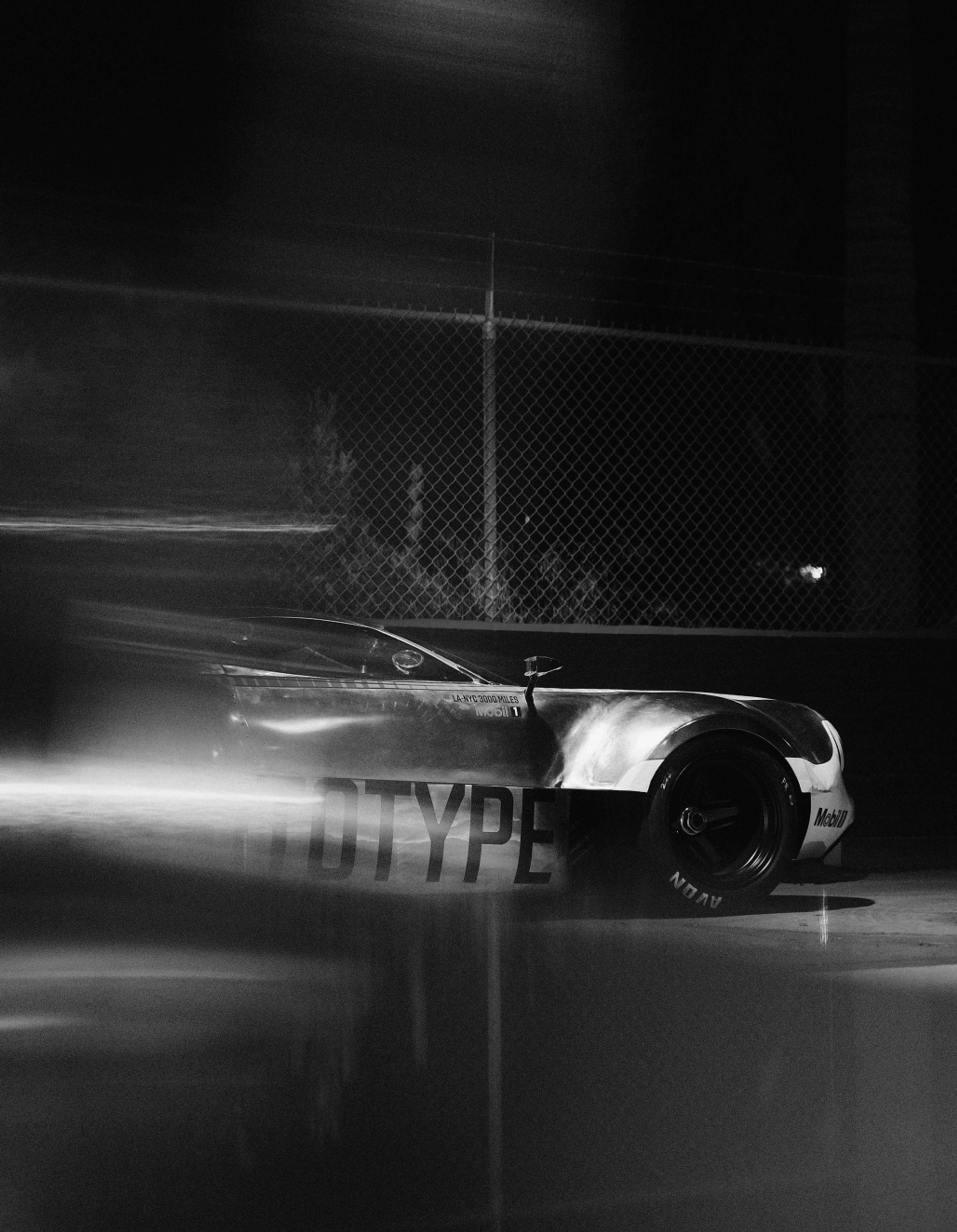 Black and white motion blur of racing car
