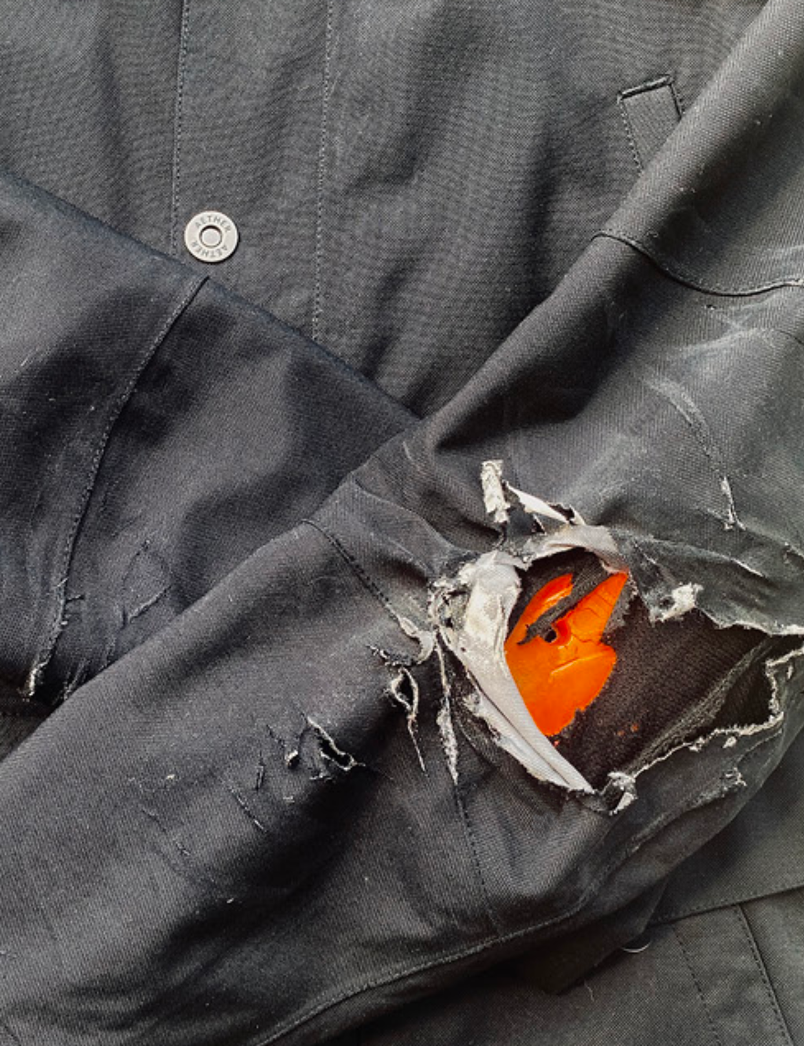 Ripped motorcycle jacket exposing D3O® pads underneath