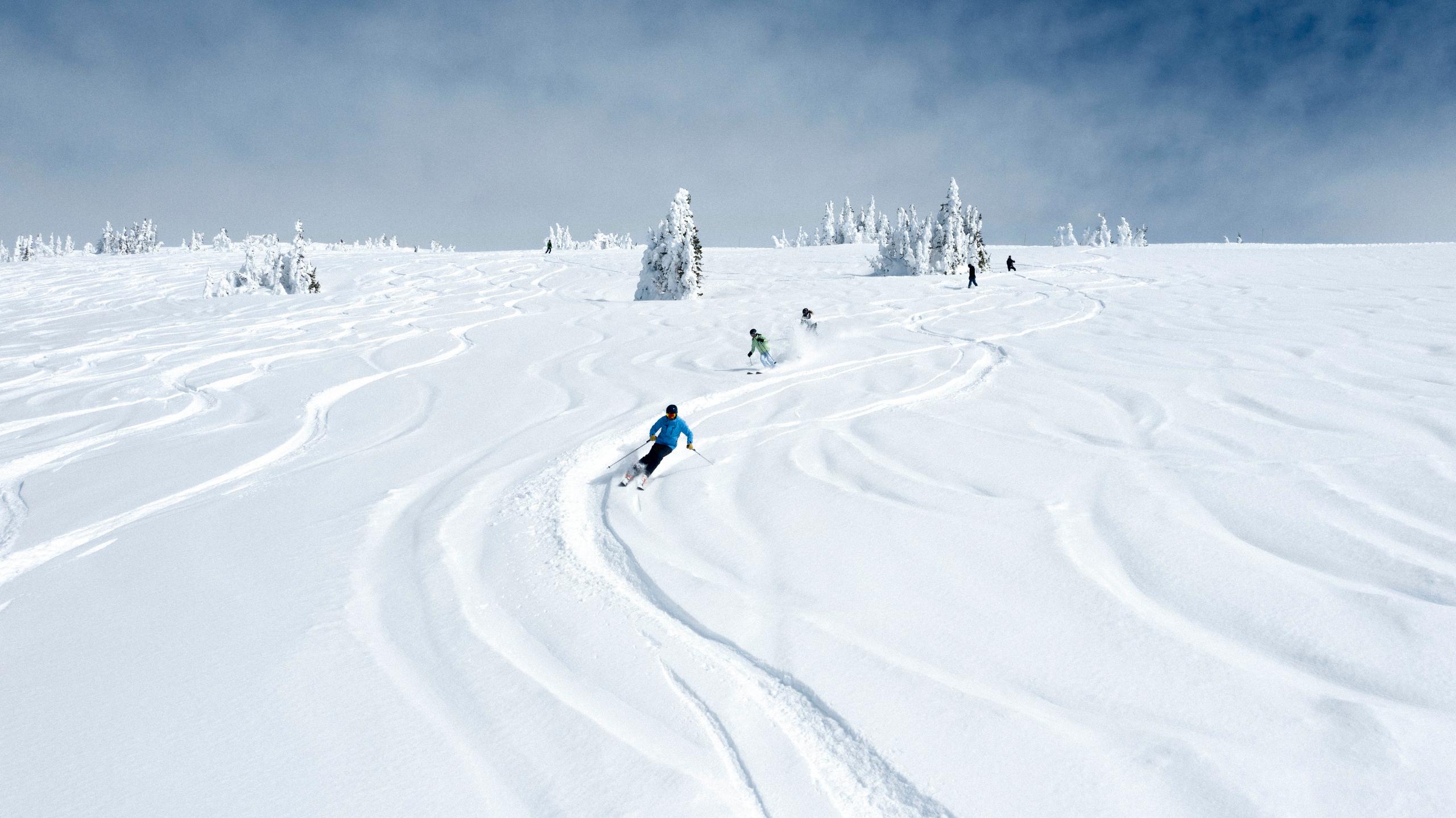 Man and two women skiing in Jackson Hole, Wyoming