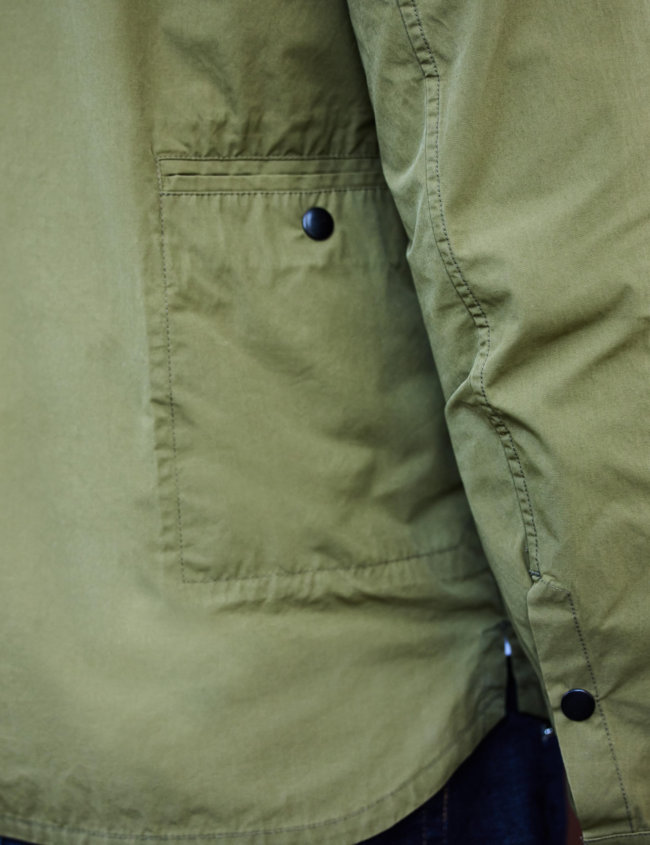 Detail side pocket view of man wearing Echo Jacket