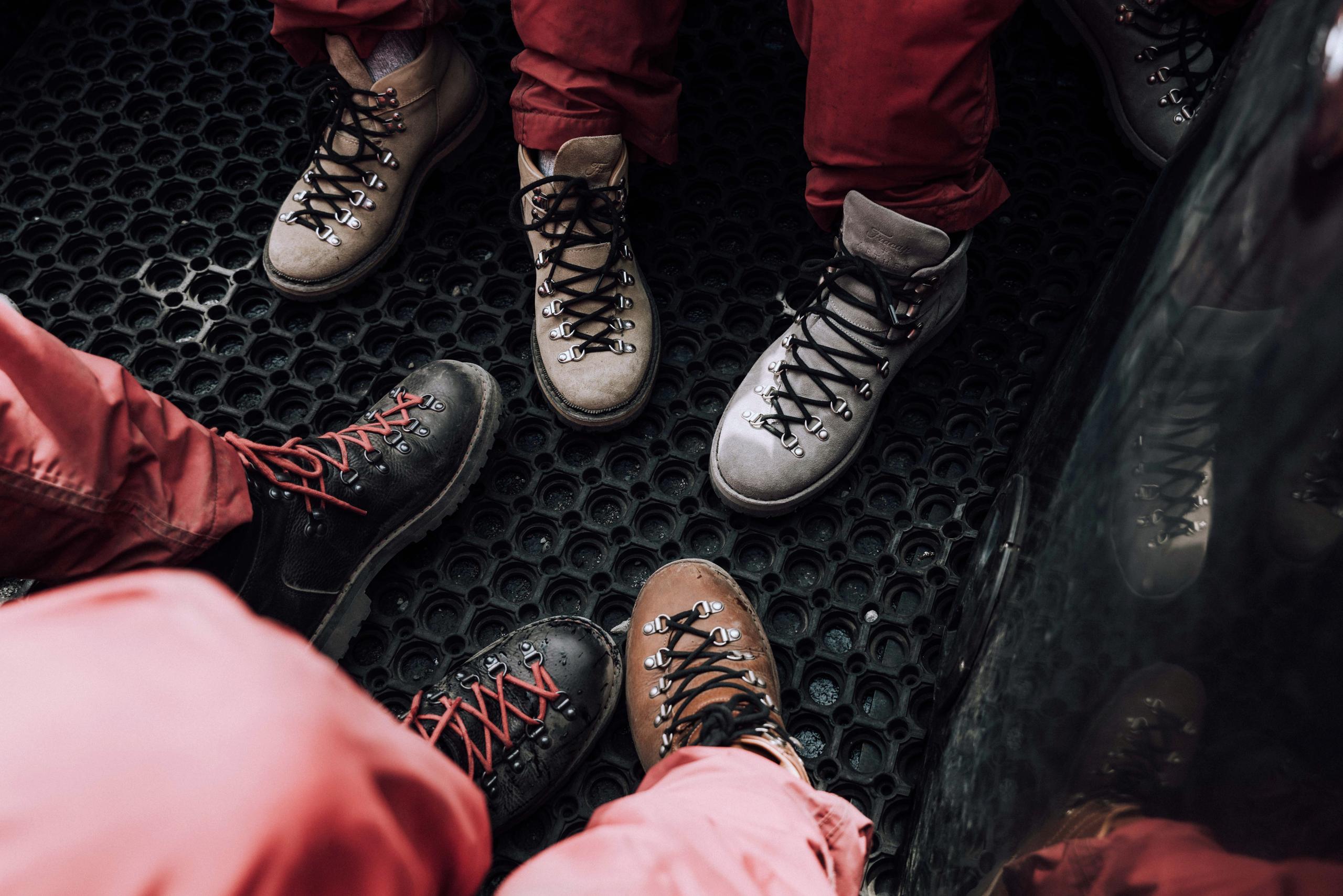 Closeup of people's boots in boat