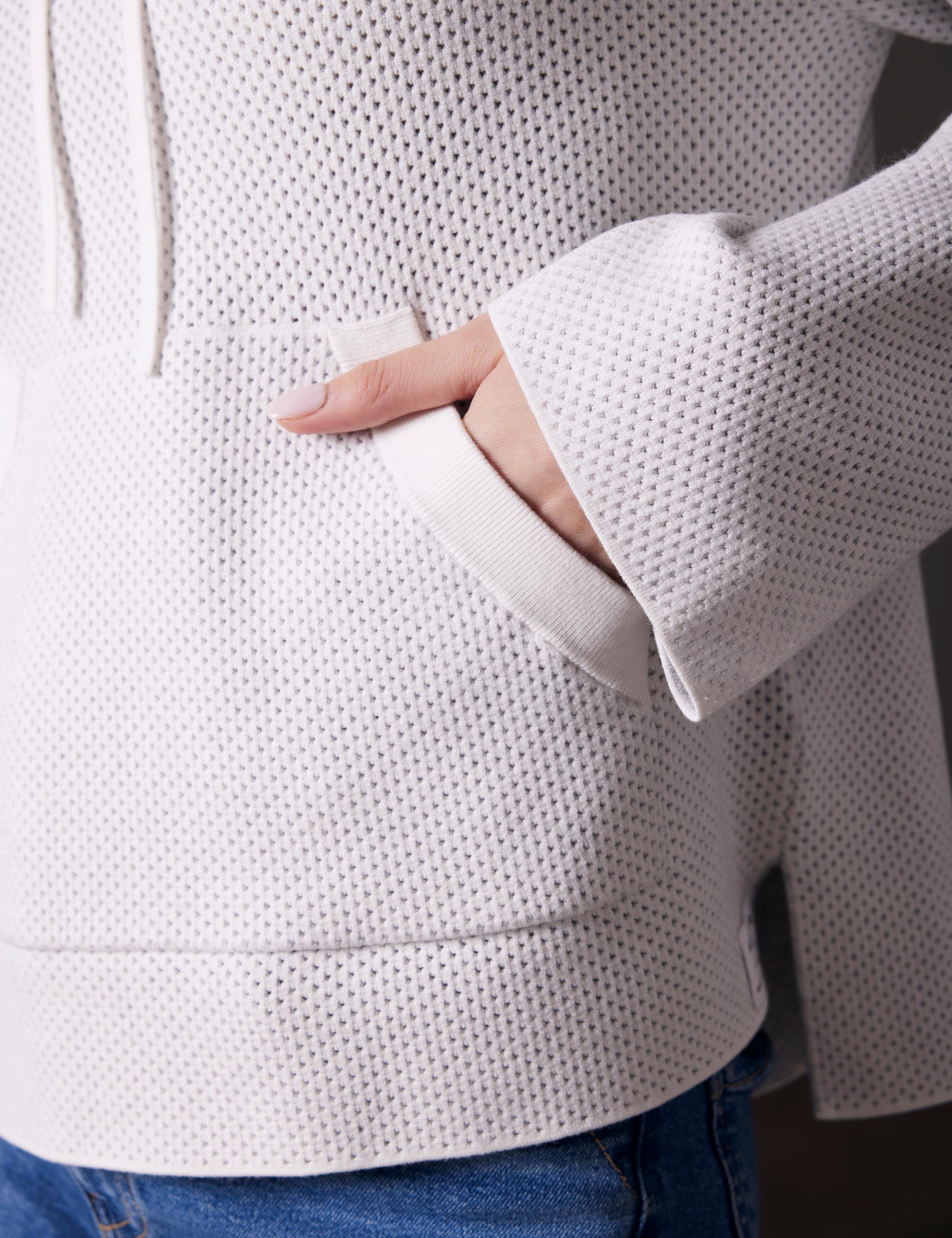 Baja mesh sweater's front pocket detail.