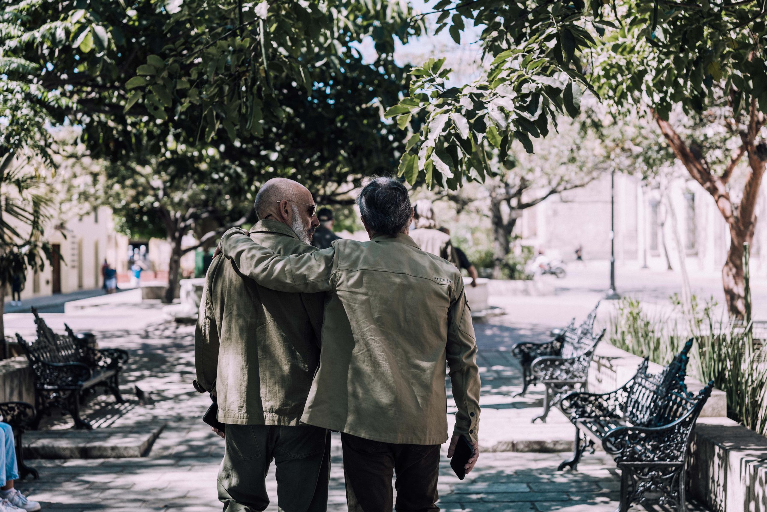 Two old friends walking in Mexico City