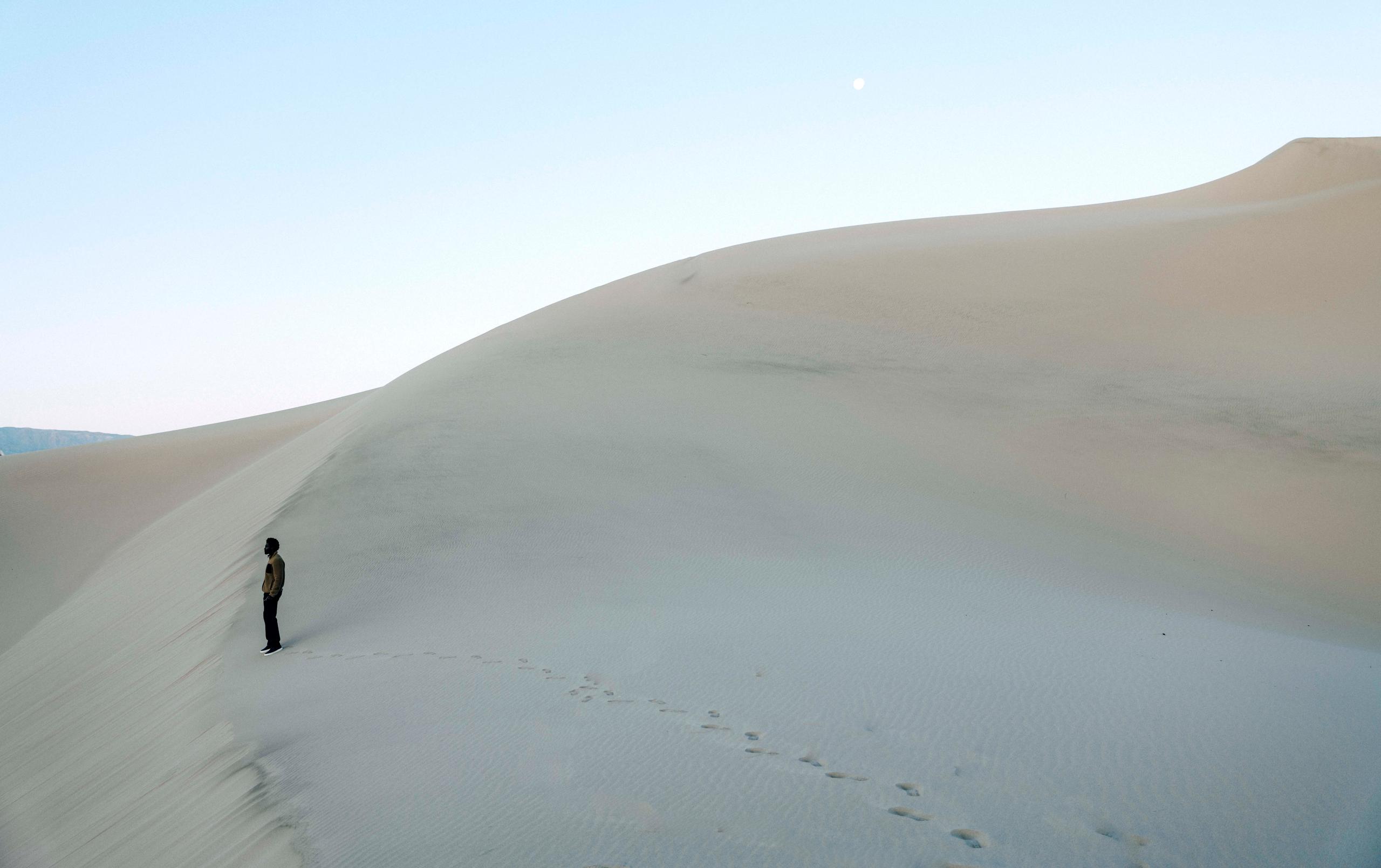 Man in Walsh Full-Zip standing on the desert.