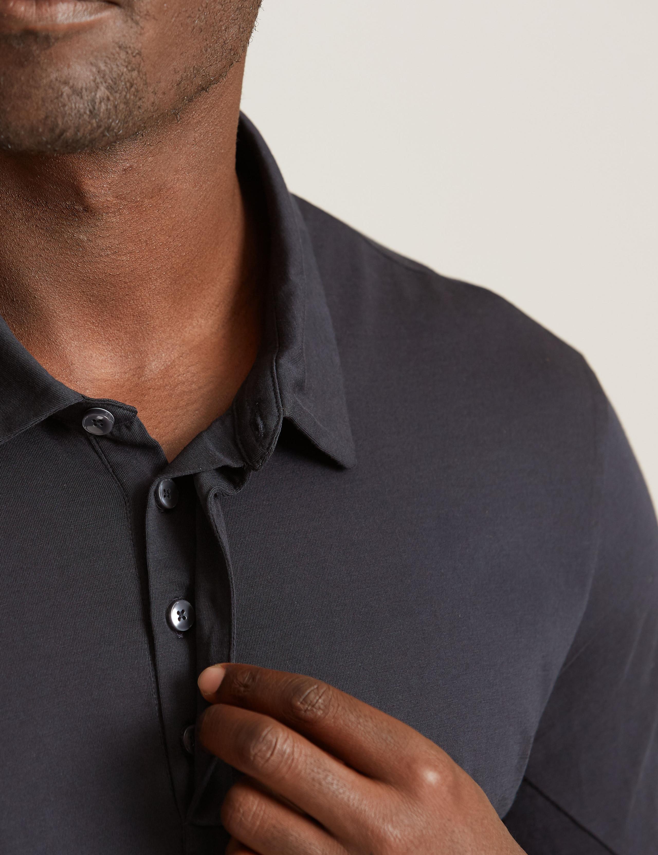 Detail of collar of man wearing Core Jersey Polo