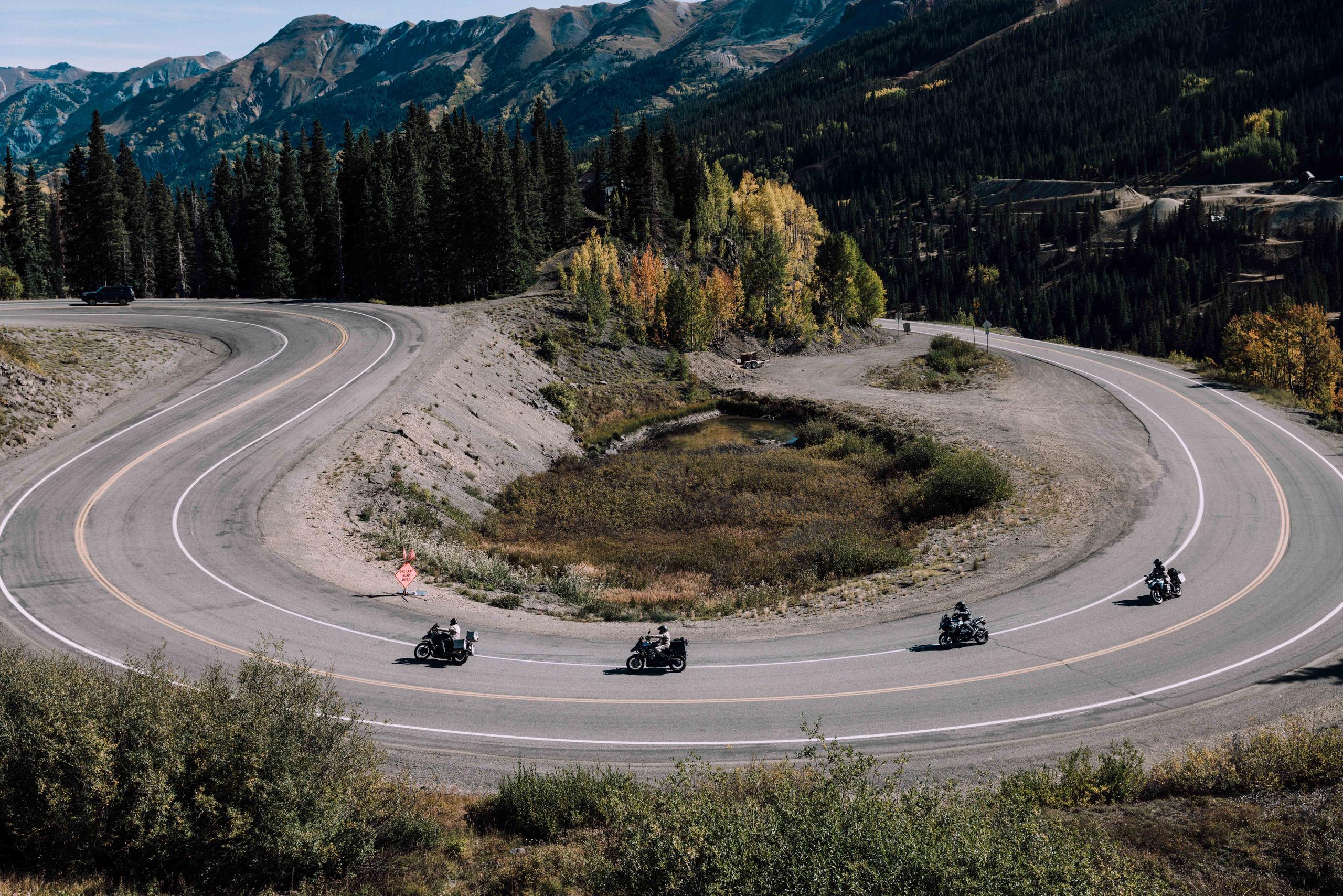 Four motorcyclists on windy road in Colorado