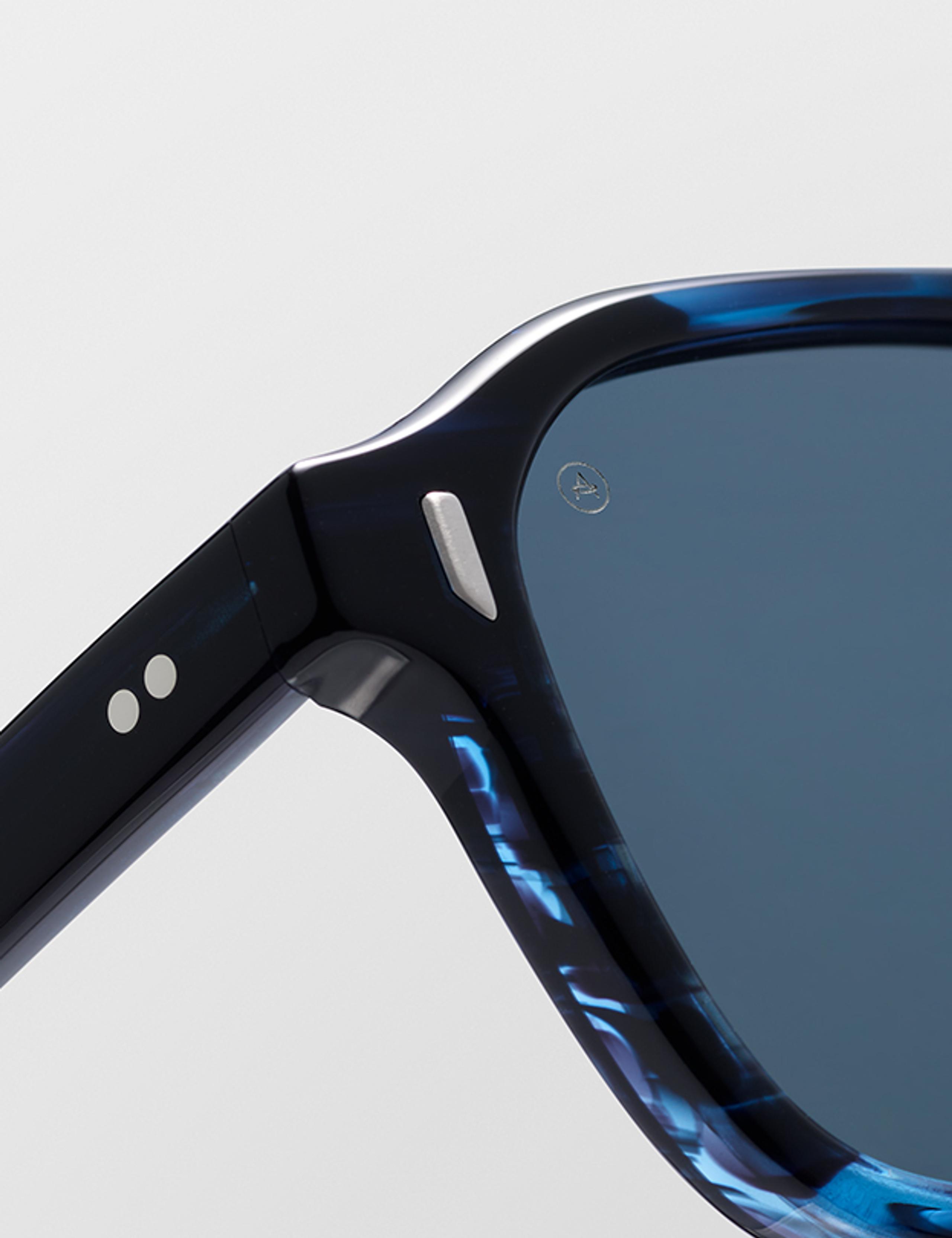 Closeup view of hinge and lens of Sequoia in Blue Tortoise