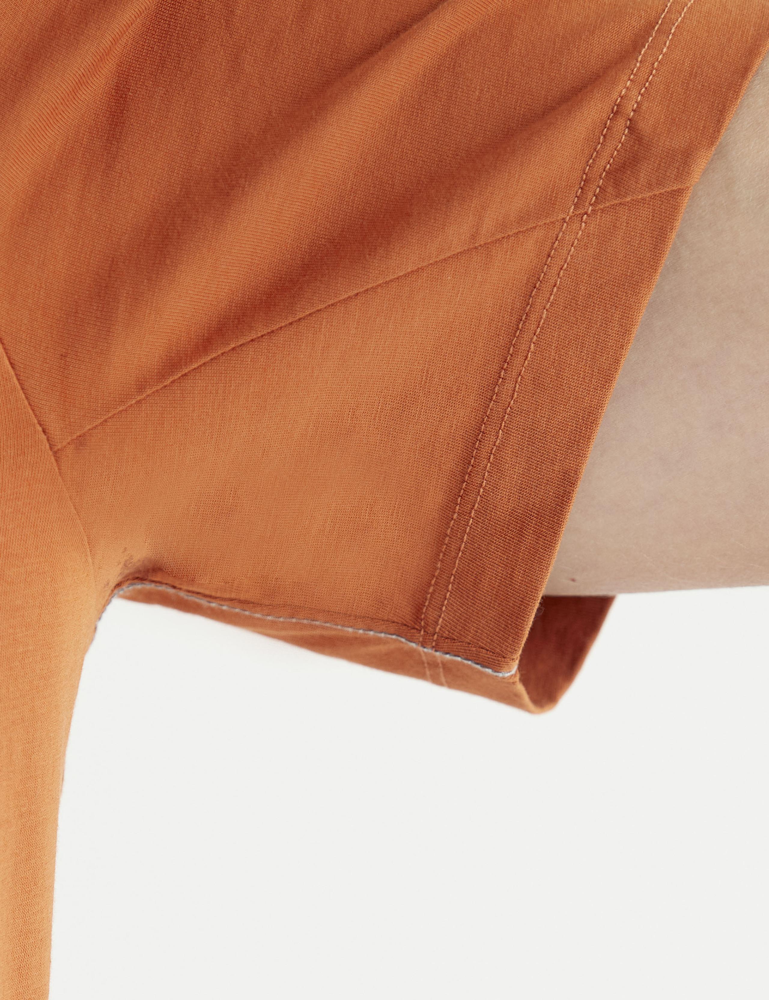 Closeup view of angled seam at the underarm of the Core Tee