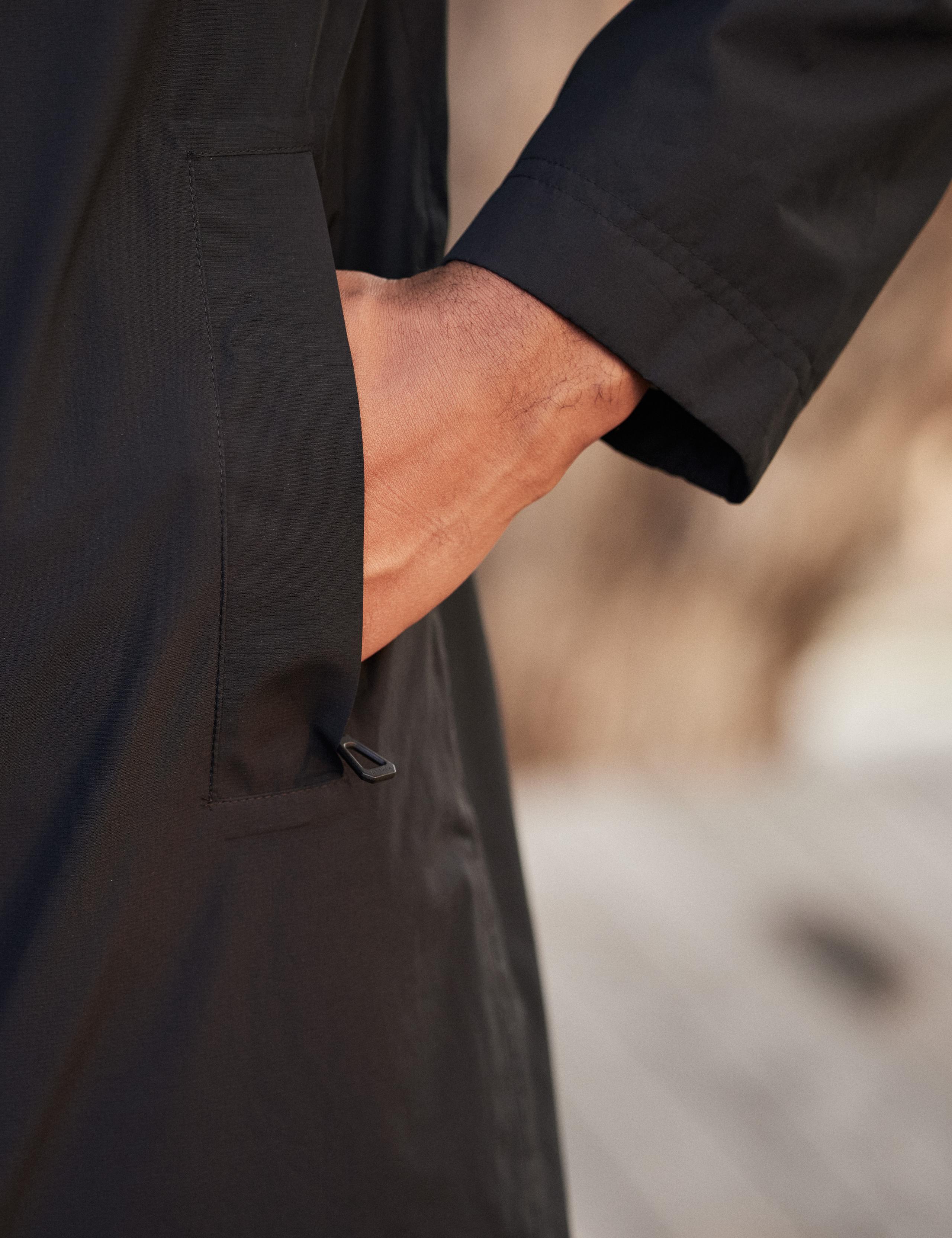 Detail of front pocket of man wearing Tower Gore-Tex Raincoat