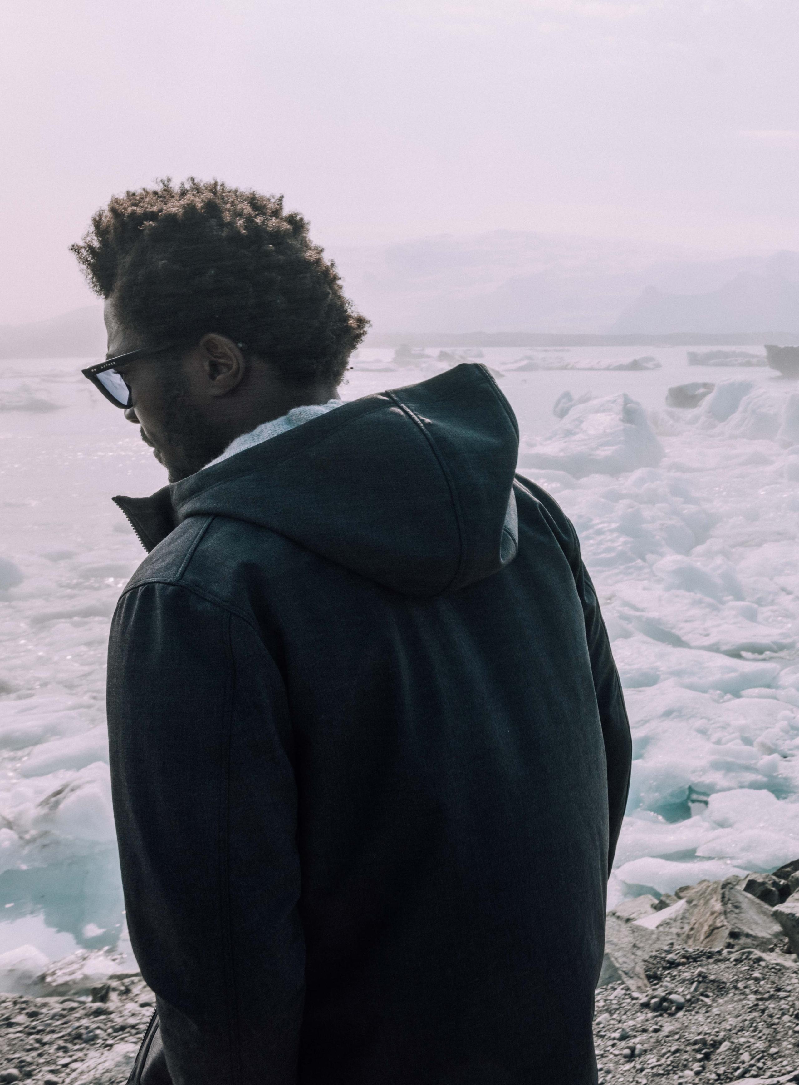 Man in Stanton Technical Jacket looking over glaciers in Iceland.