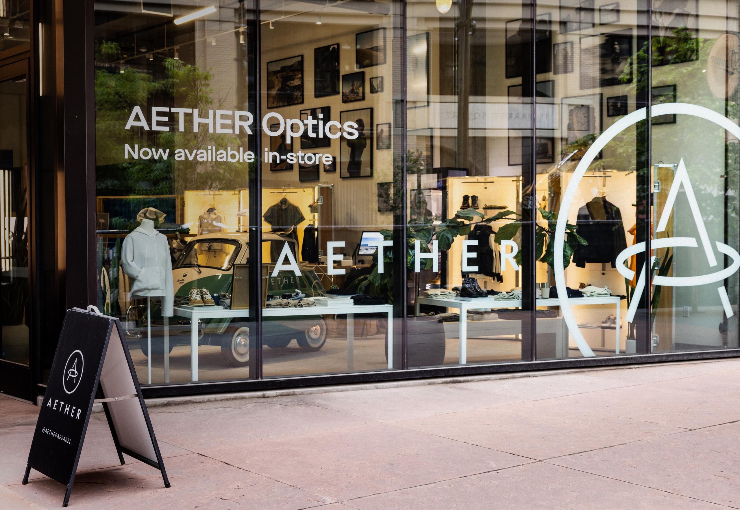 Exterior view of AETHER store with large glass facade