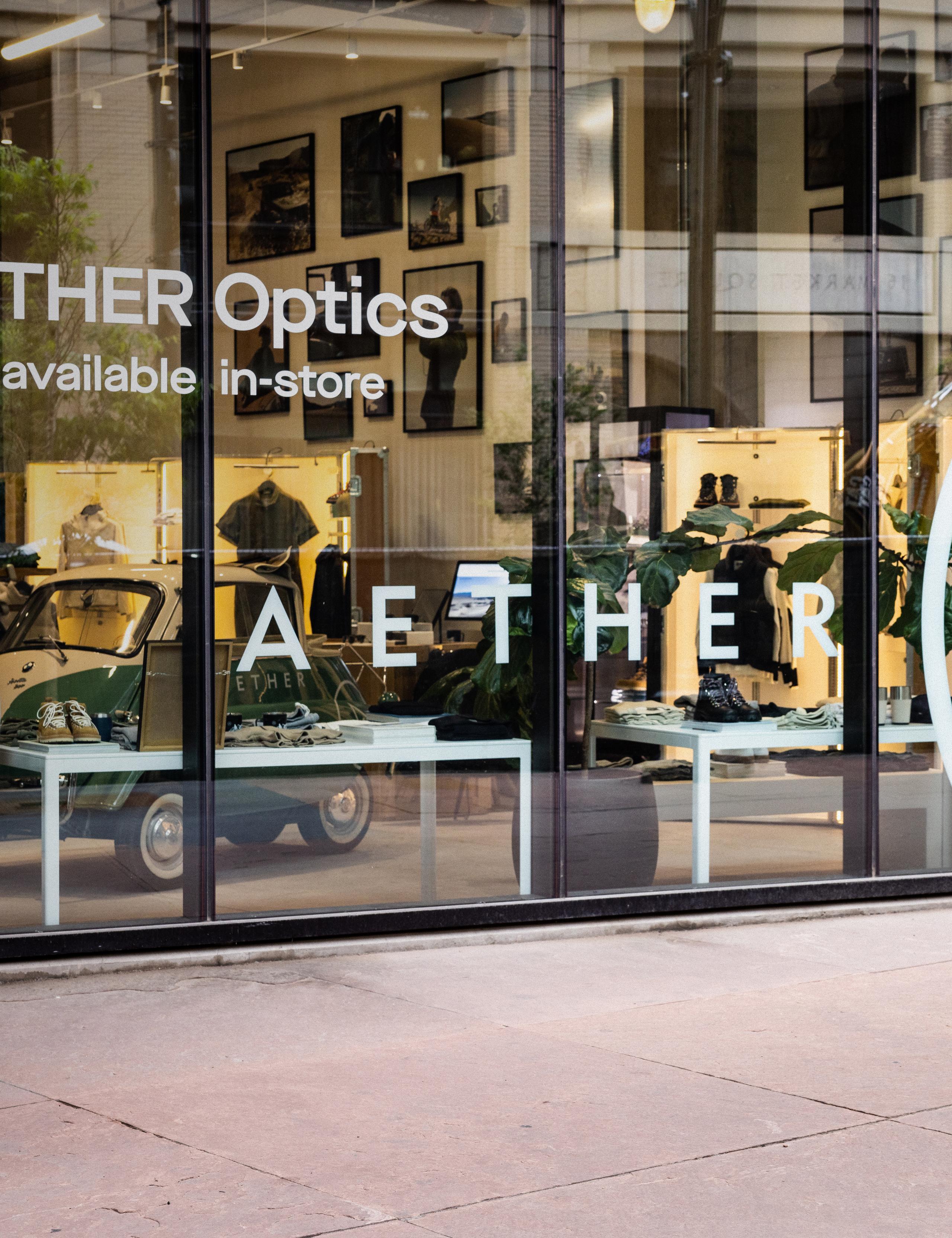 Exterior view of AETHER store with large glass facade