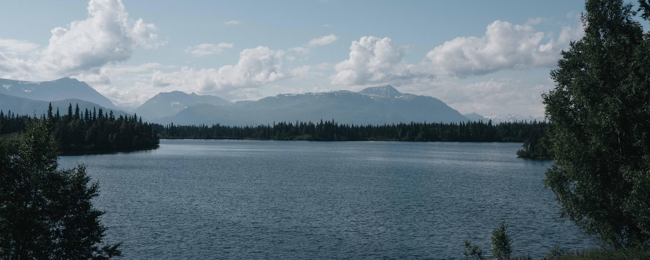 Scenic lake view in Alaska with mountains in the background