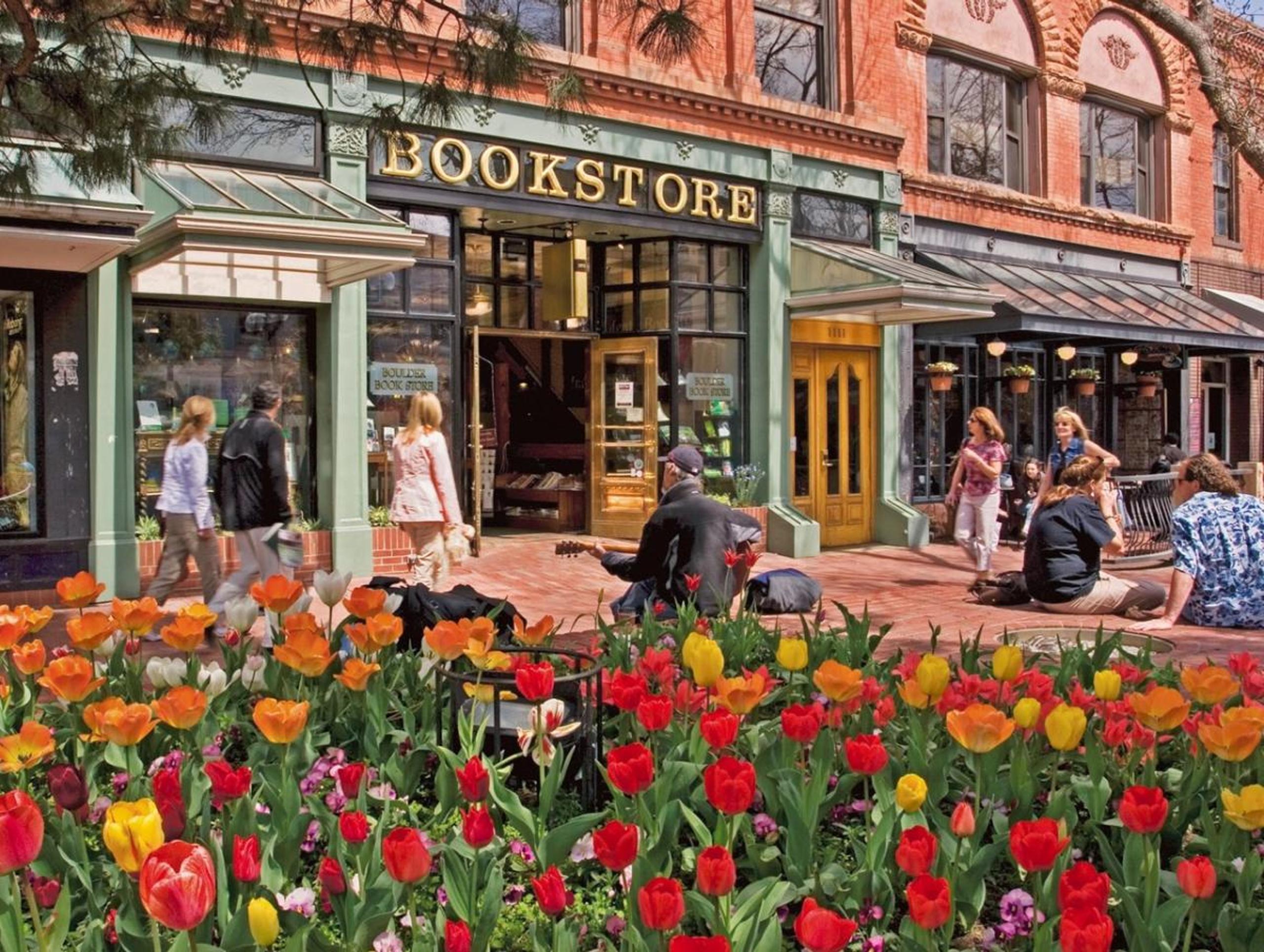 Exterior of Boulder book store with tulips in foreground