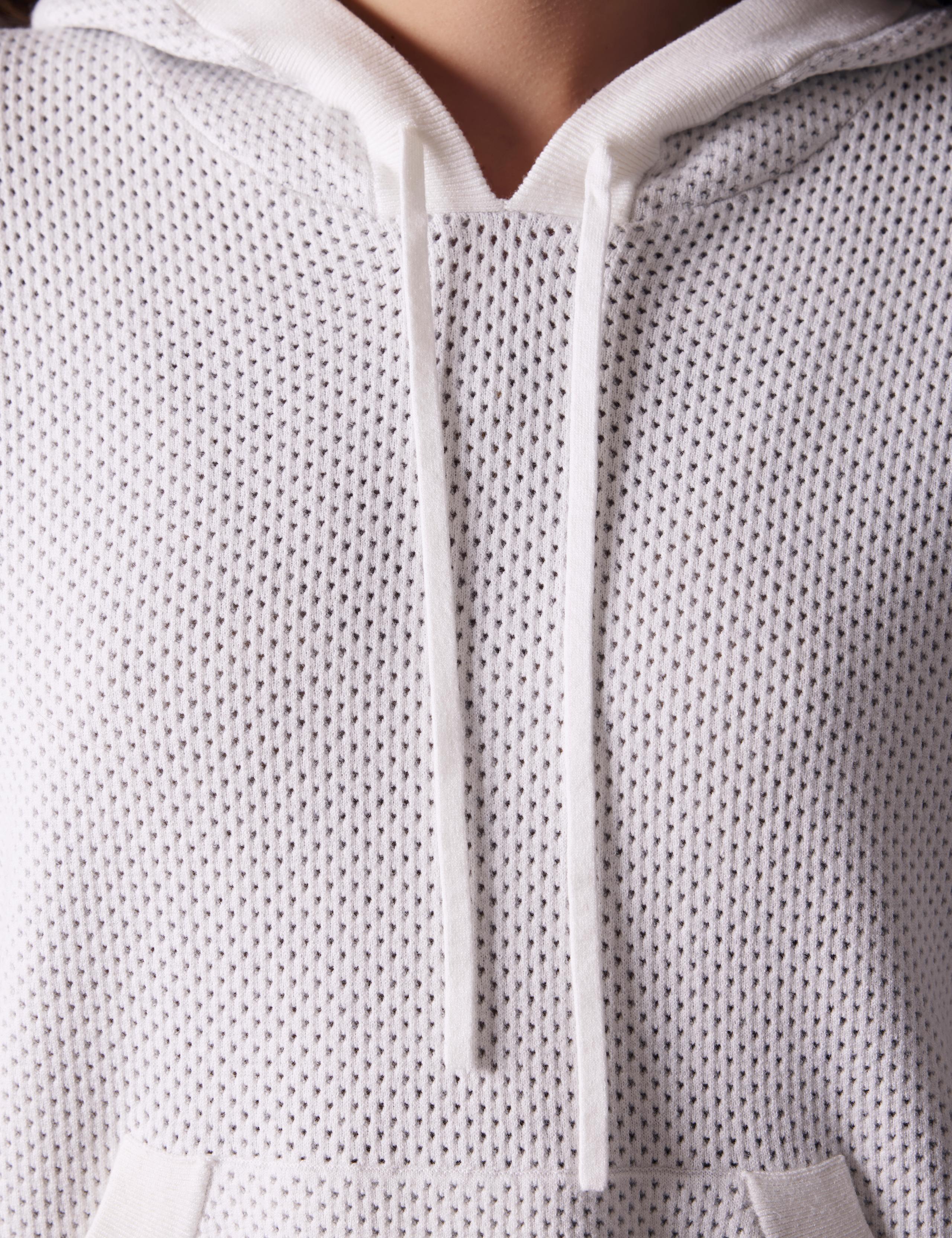 detailed shot of Baja Mesh Sweater's knitted drawcord.