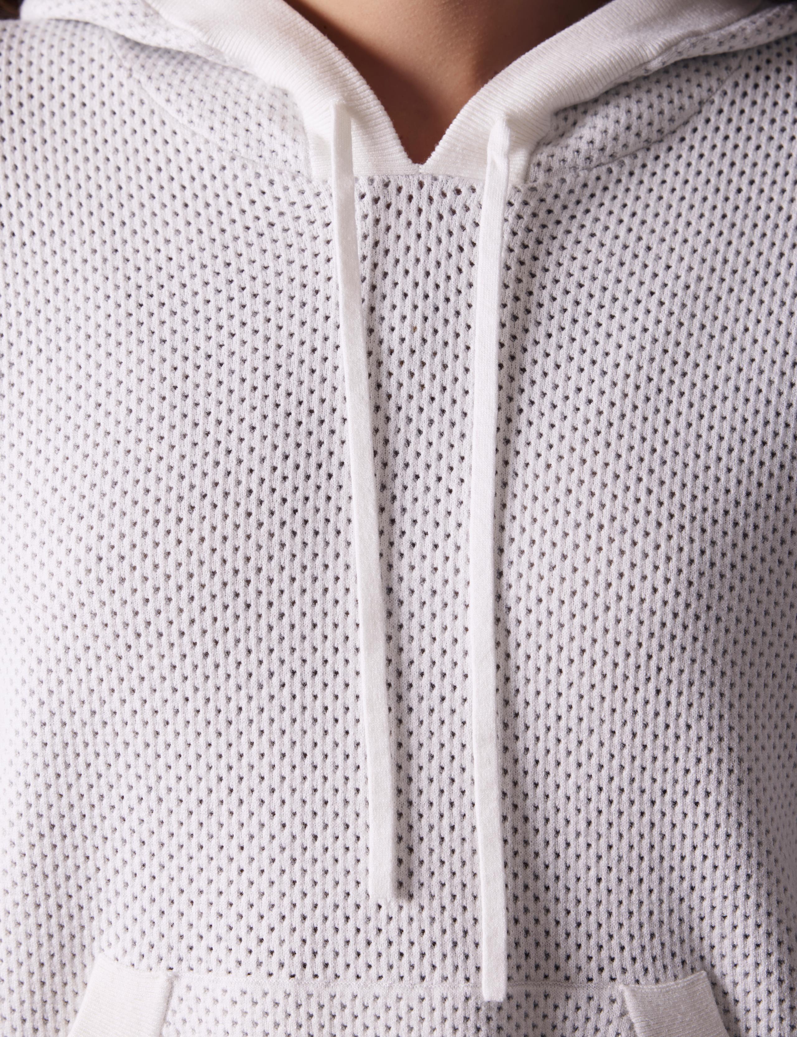 detailed shot of Baja Mesh Sweater's knitted drawcord.