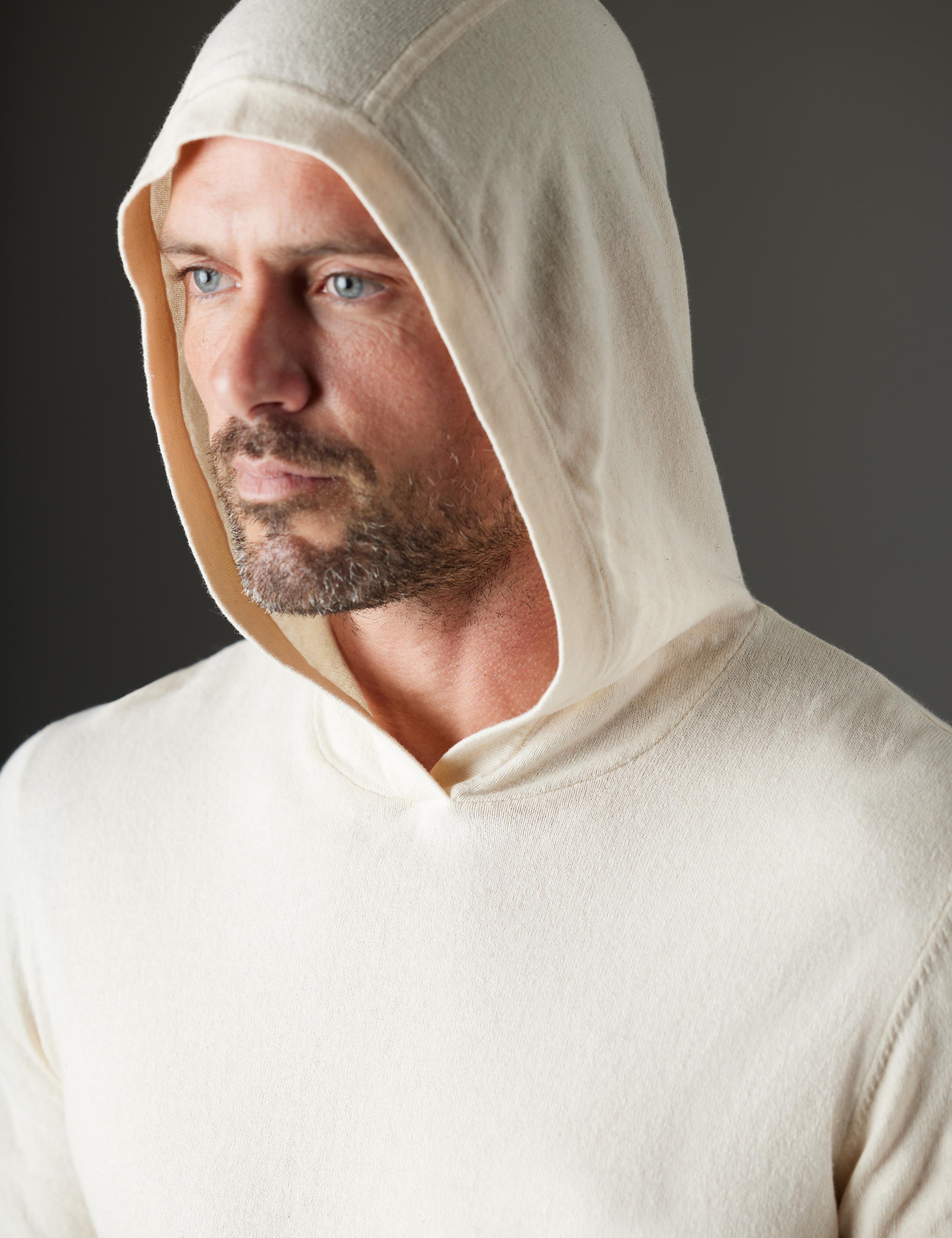Man wearing Aero Hooded Sweater with hood up 