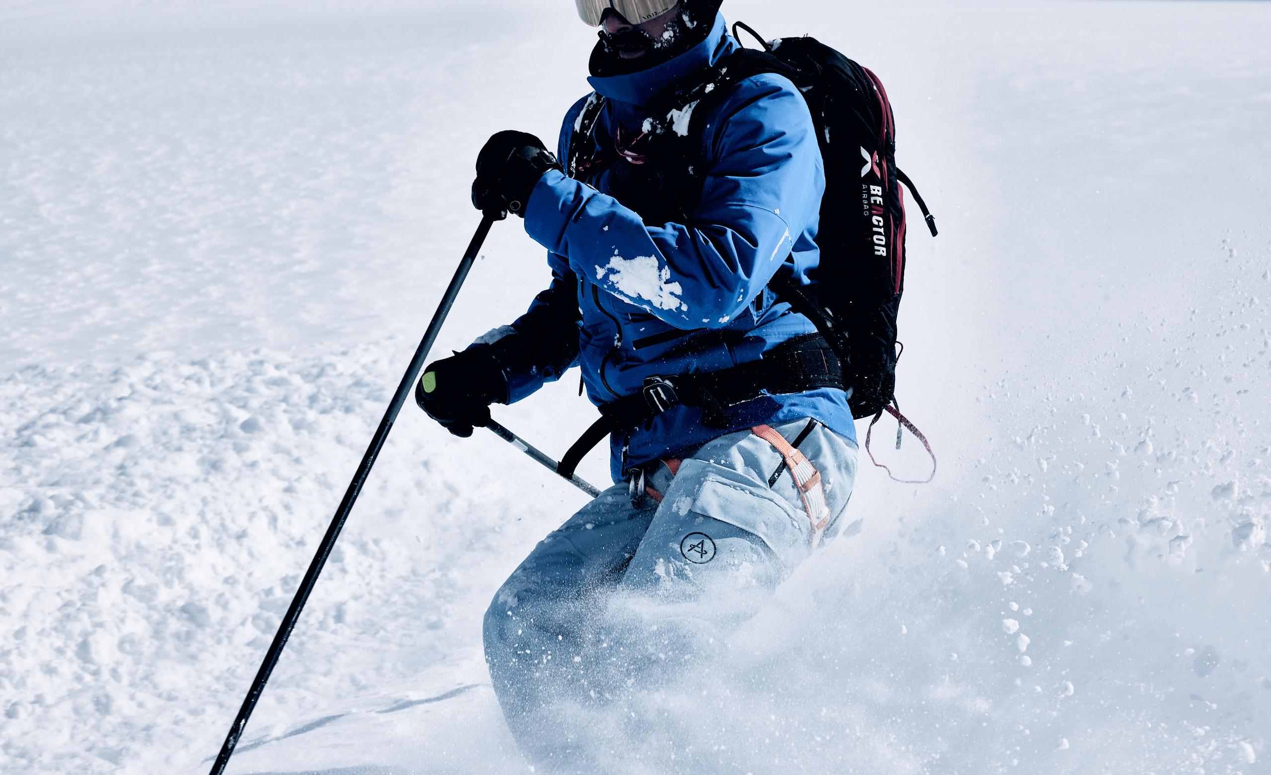 Men in Explore Snow Pant skiing down hill