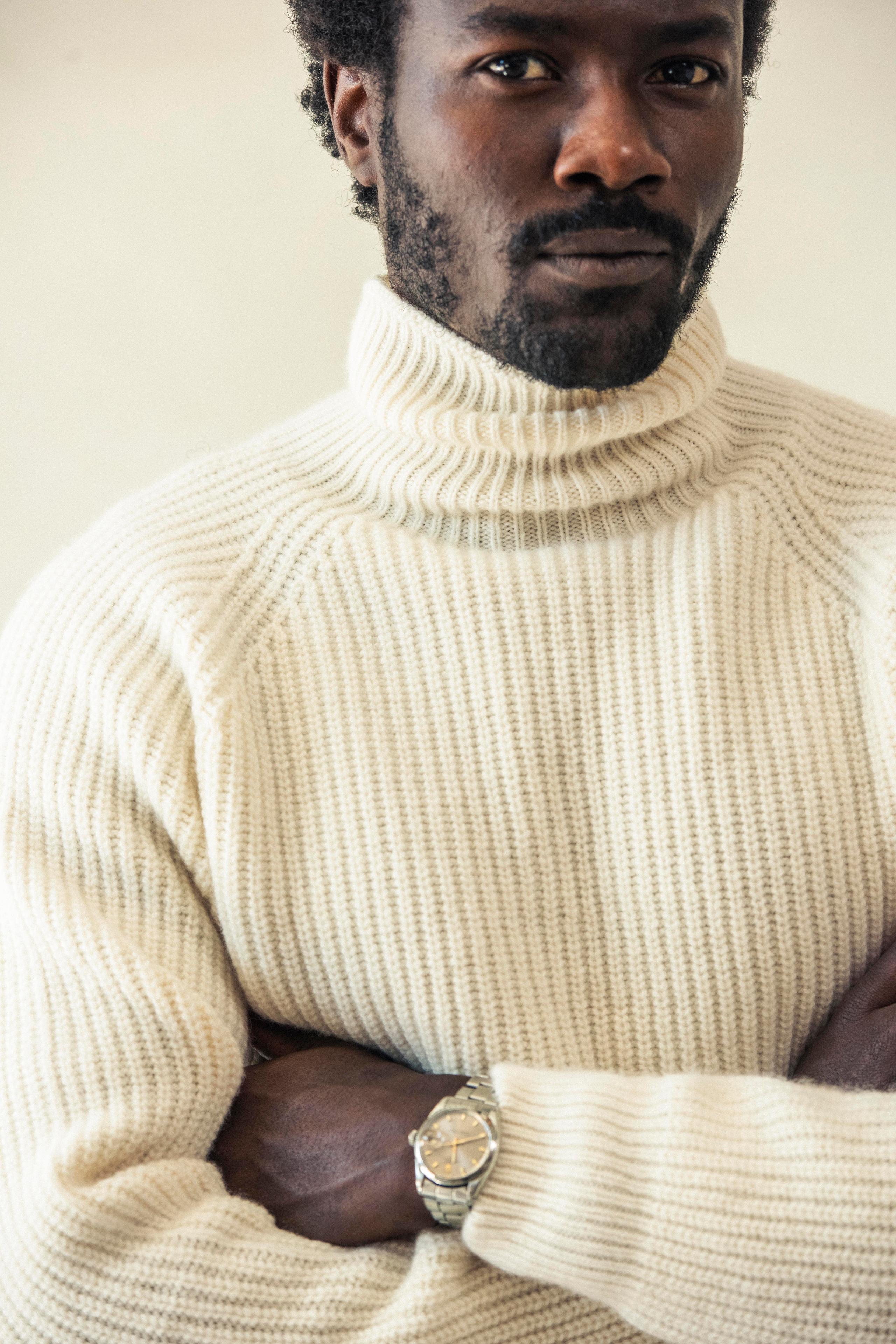 Fit model wearing the Finley Rollneck Sweater in Winter White.