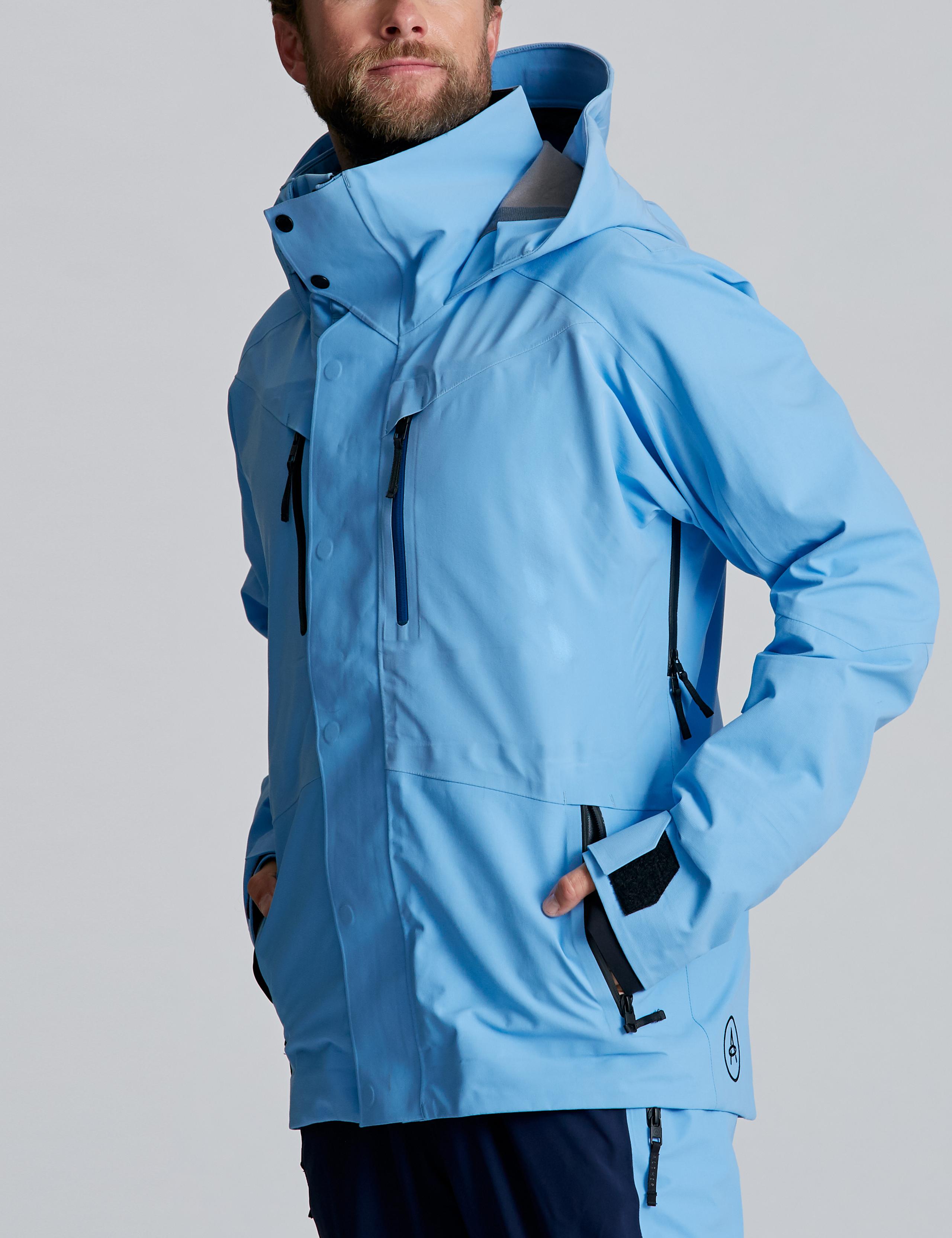 Man wearing Stealth Snow Jacket in Atlas Blue in studio