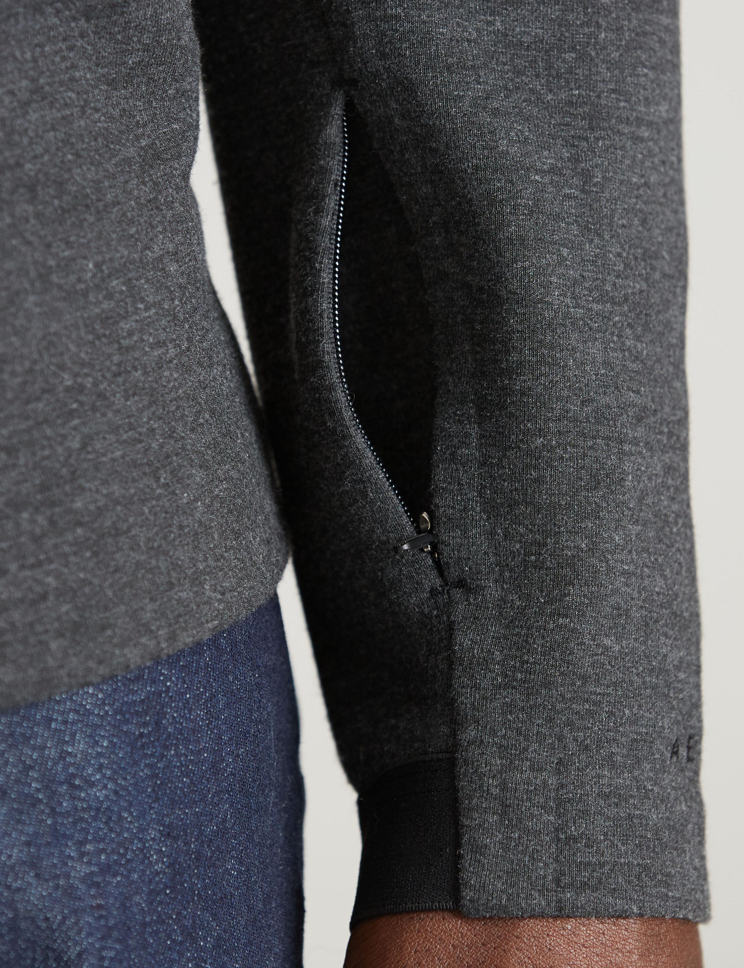 Detail of hidden pocket on sleeve of man wearing Forge Hoodie