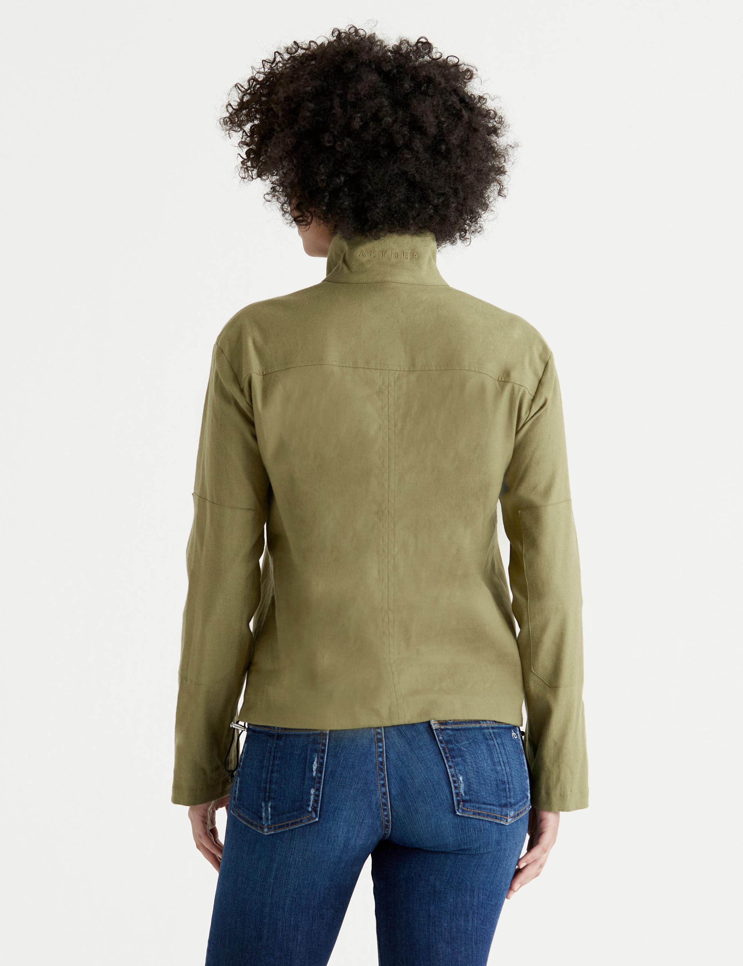 Back view of woman wearing Mara Anorak in Scout Green