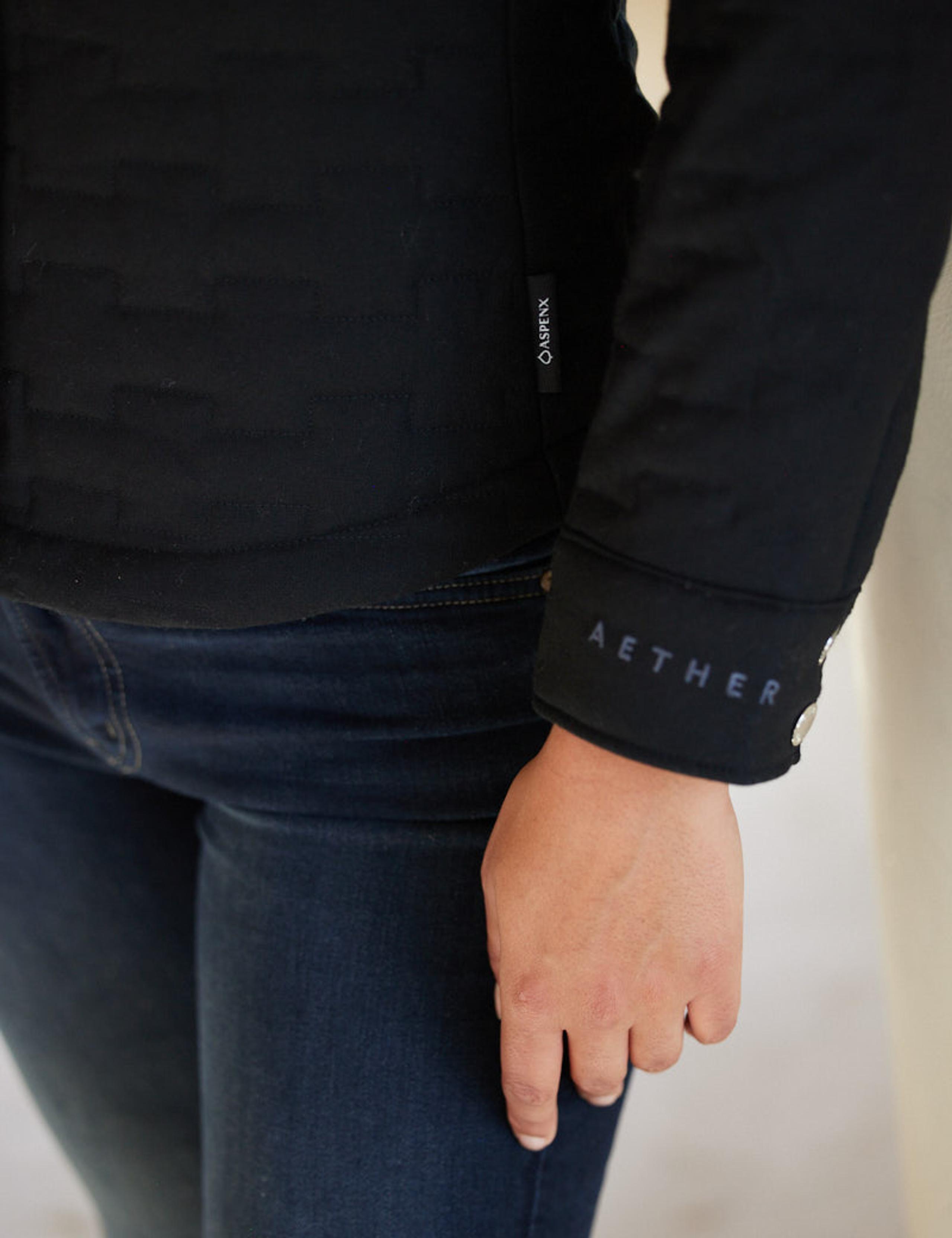Closeup of sleeve with AETHER logo