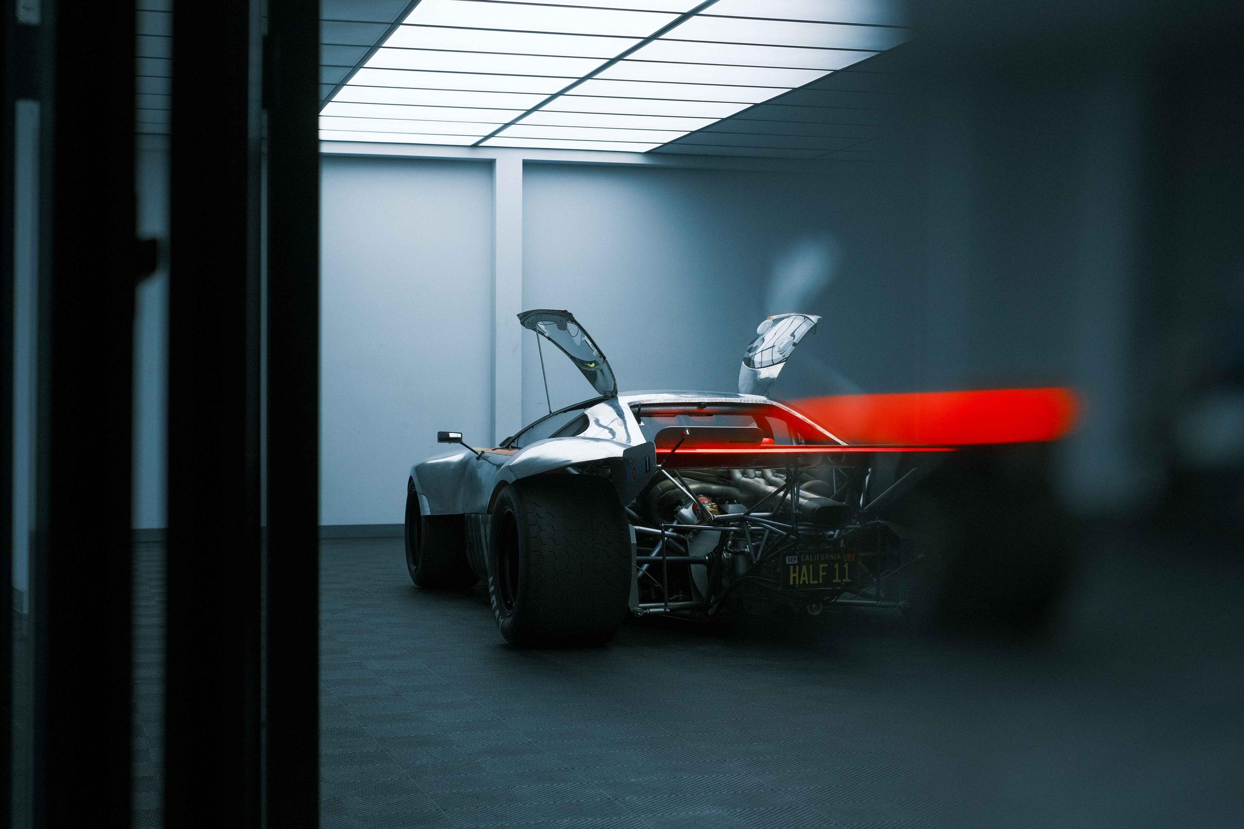 Oilstainlab's Half11 prototype race car in modern interior room
