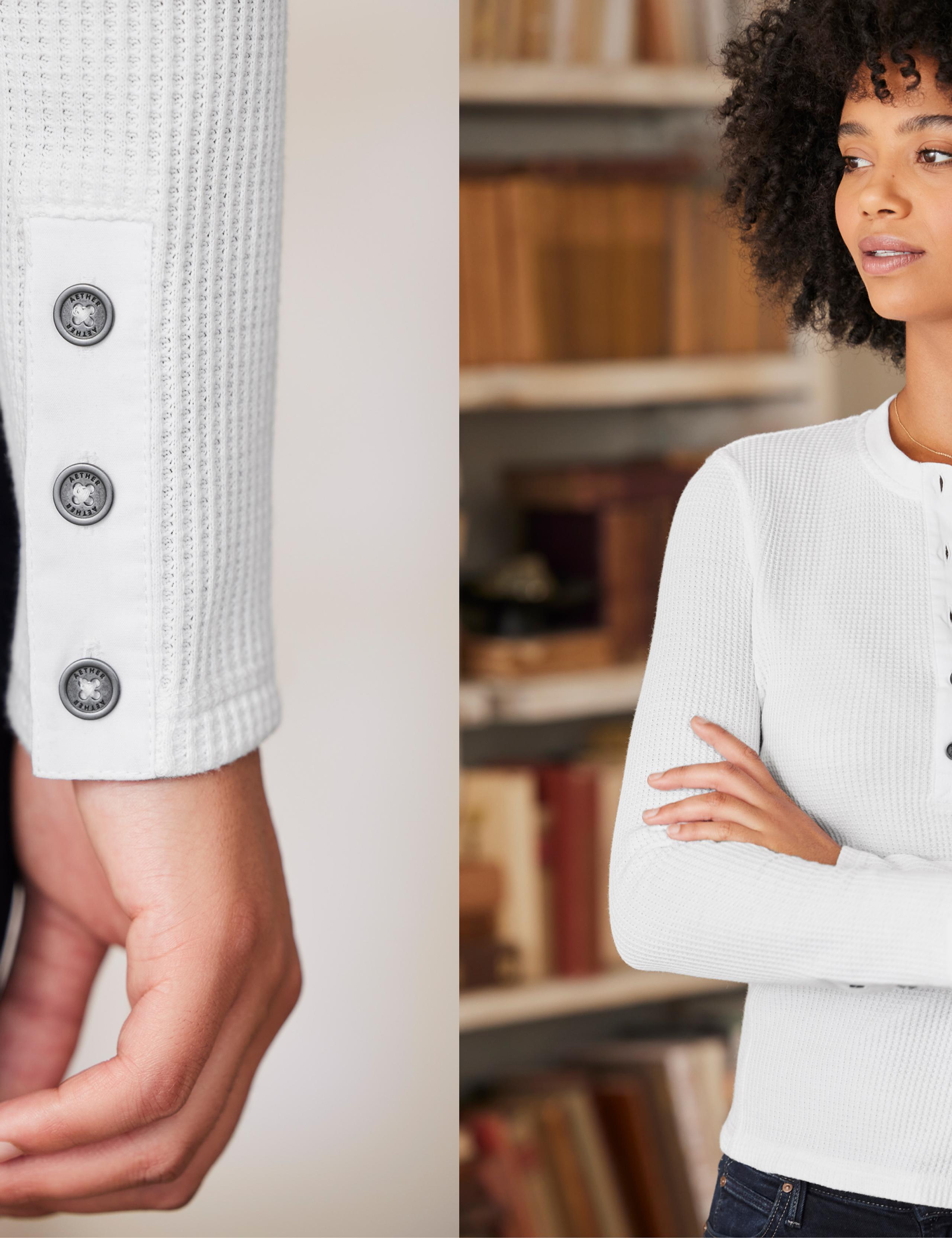 Detail of button sleeve next to woman wearing Waffle Long-Sleeve Henley