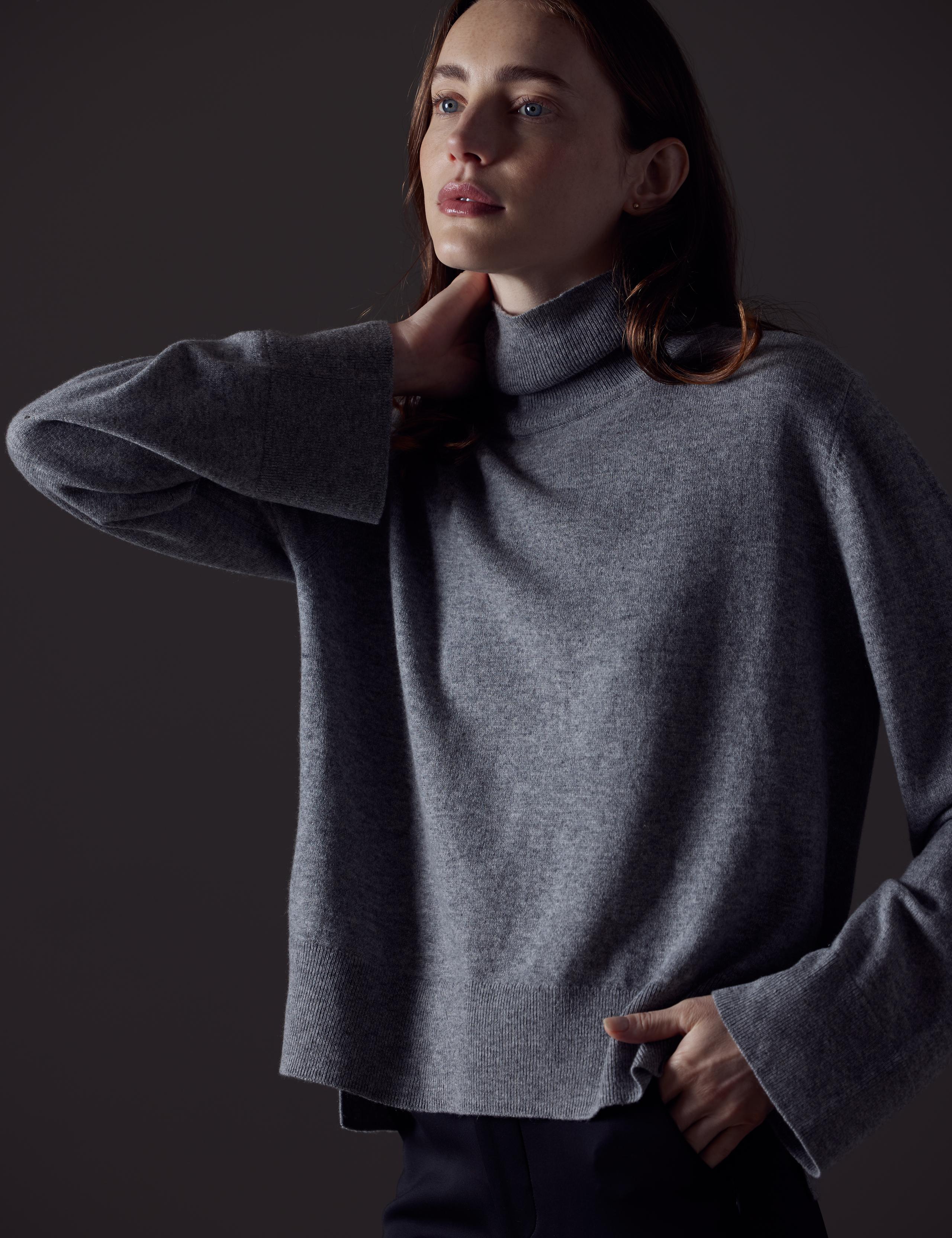 Woman in studio wearing the Leigh Cashmere Turtleneck Sweater
