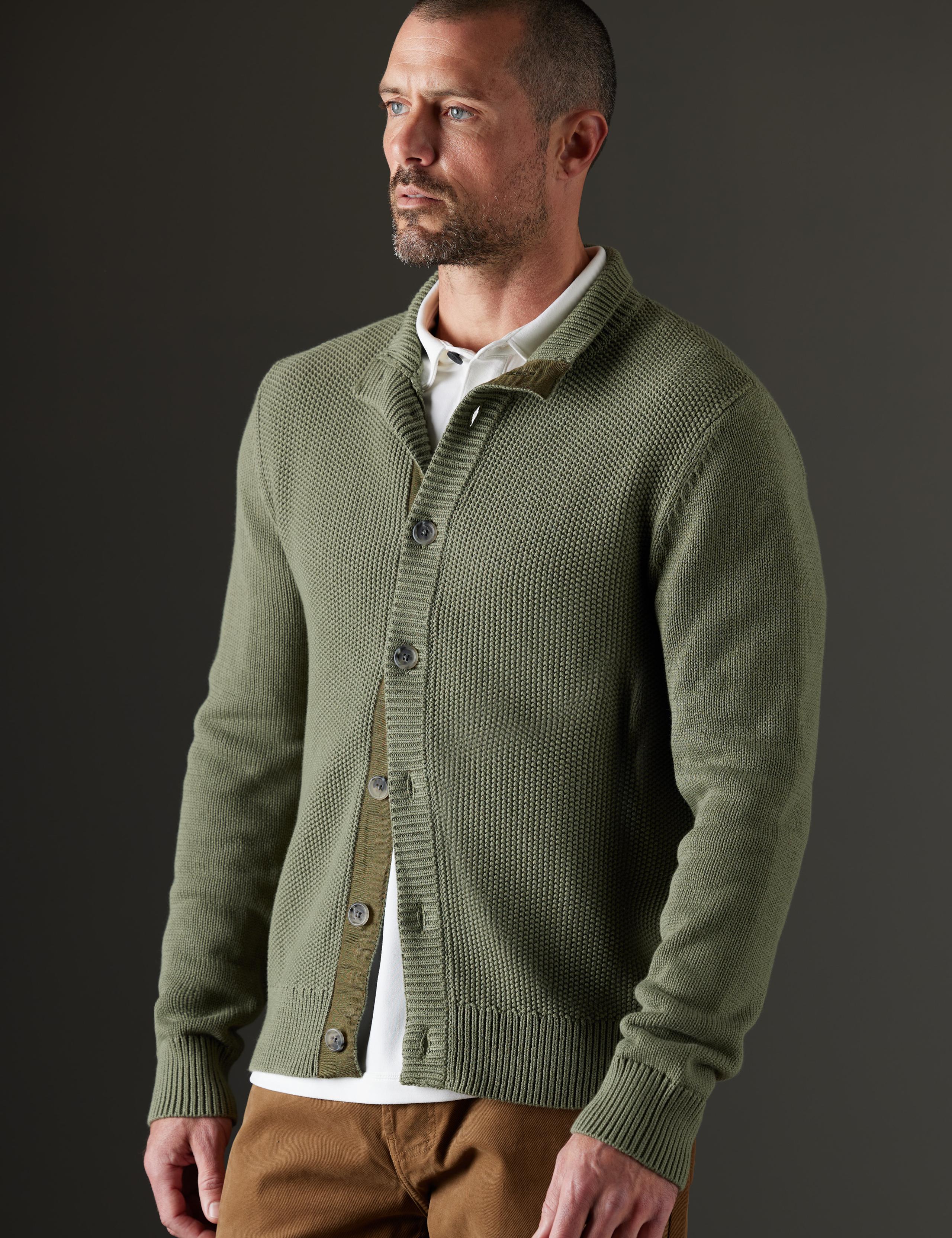 Man in studio wearing the Oliver Button-Up Sweater in Fern Green