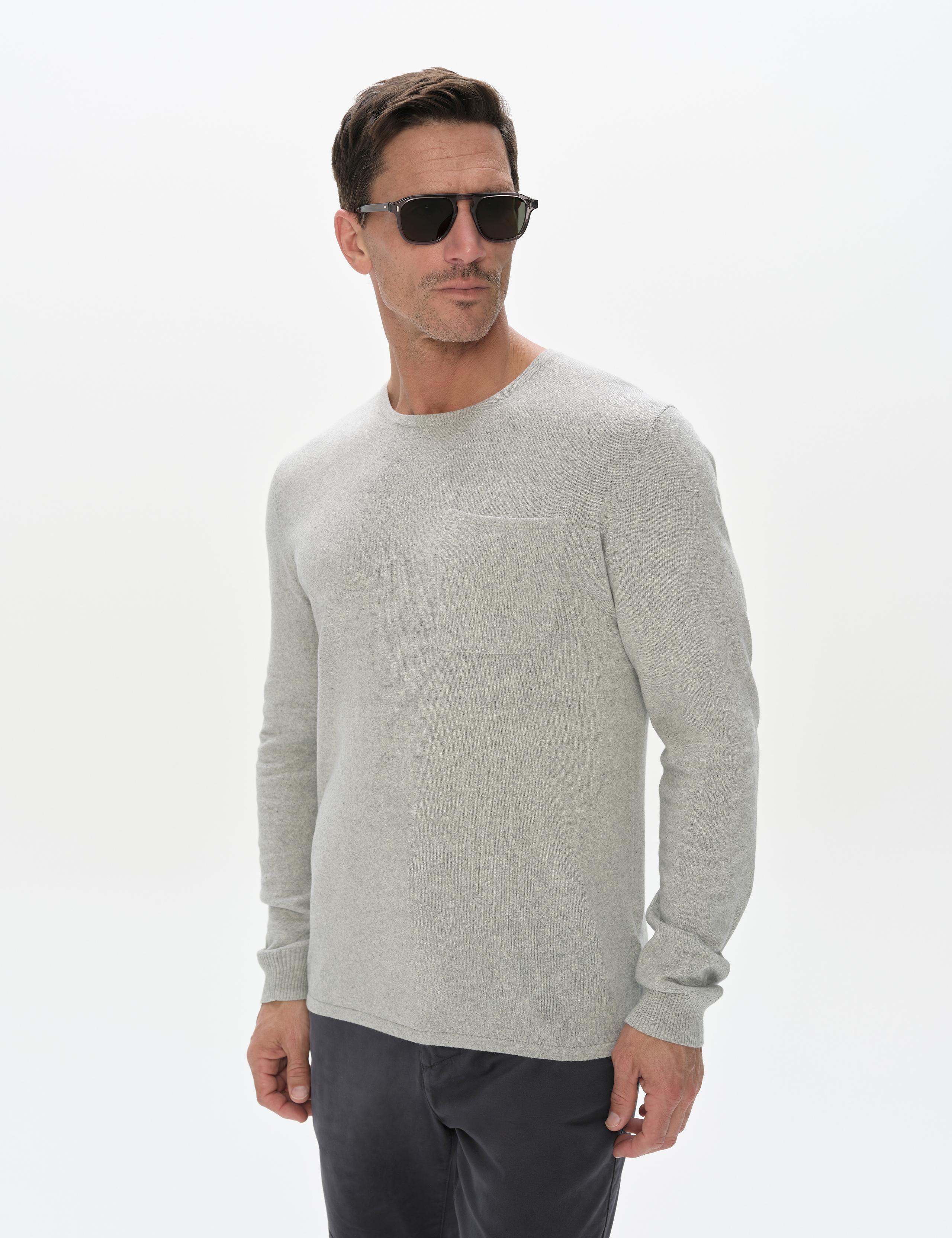 Man wearing the Aero Crewneck Sweater 2.0 in Grey