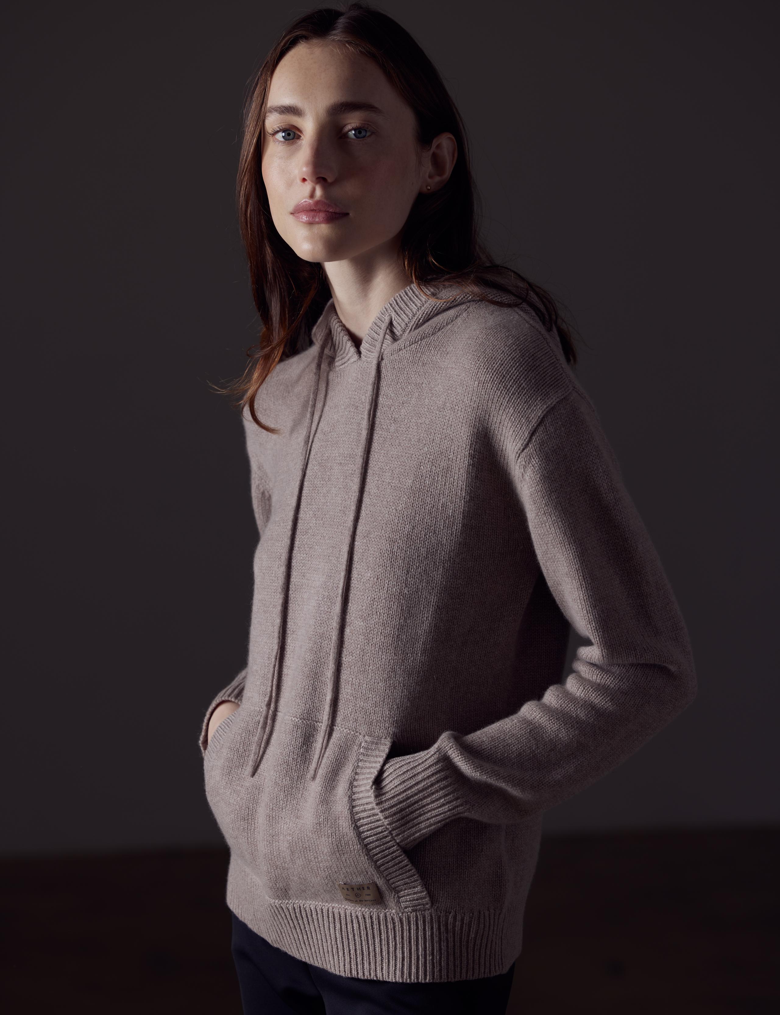 Woman in studio wearing the Ava Cashmere Hooded Sweater