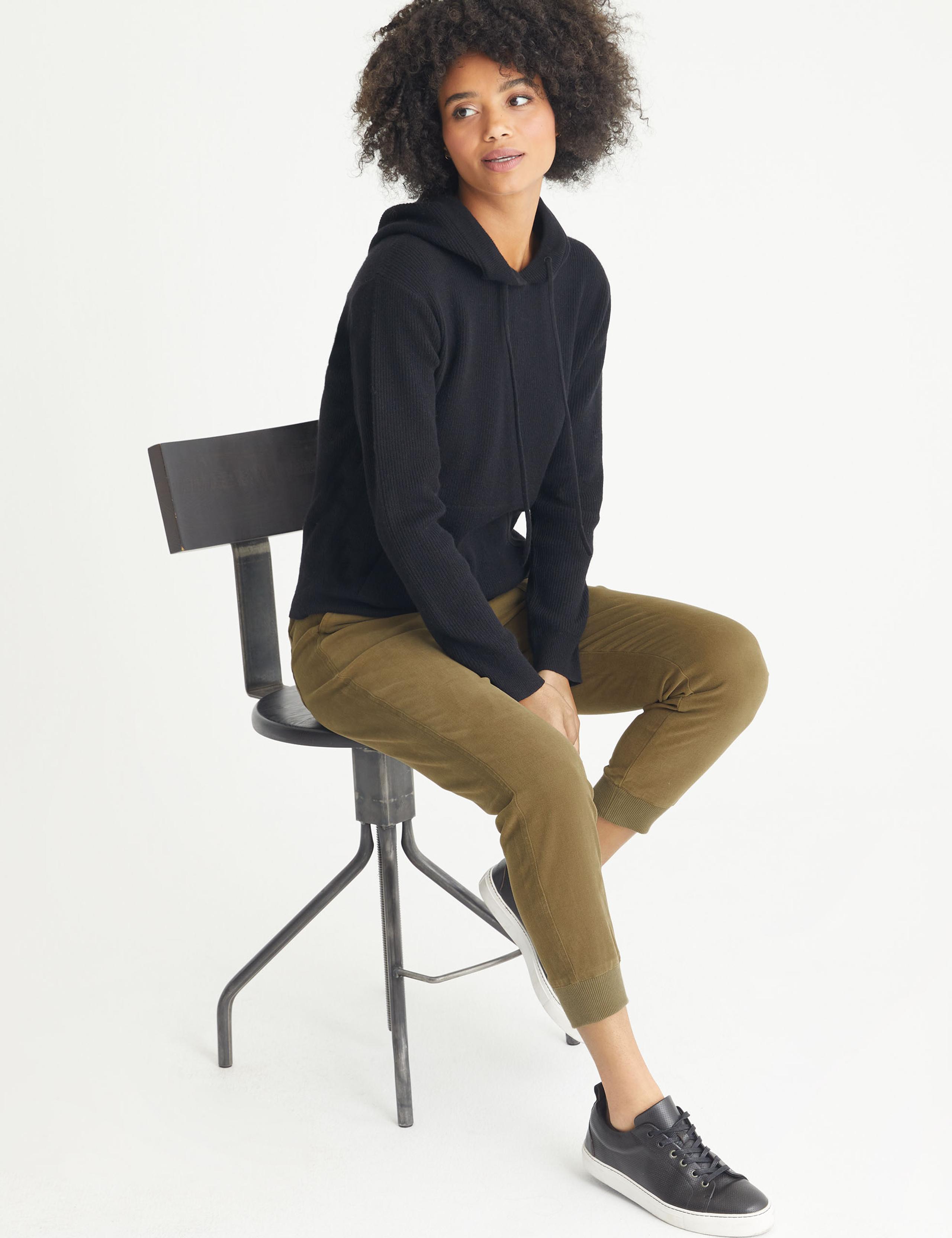 Women wearing Friday Pant on a stool