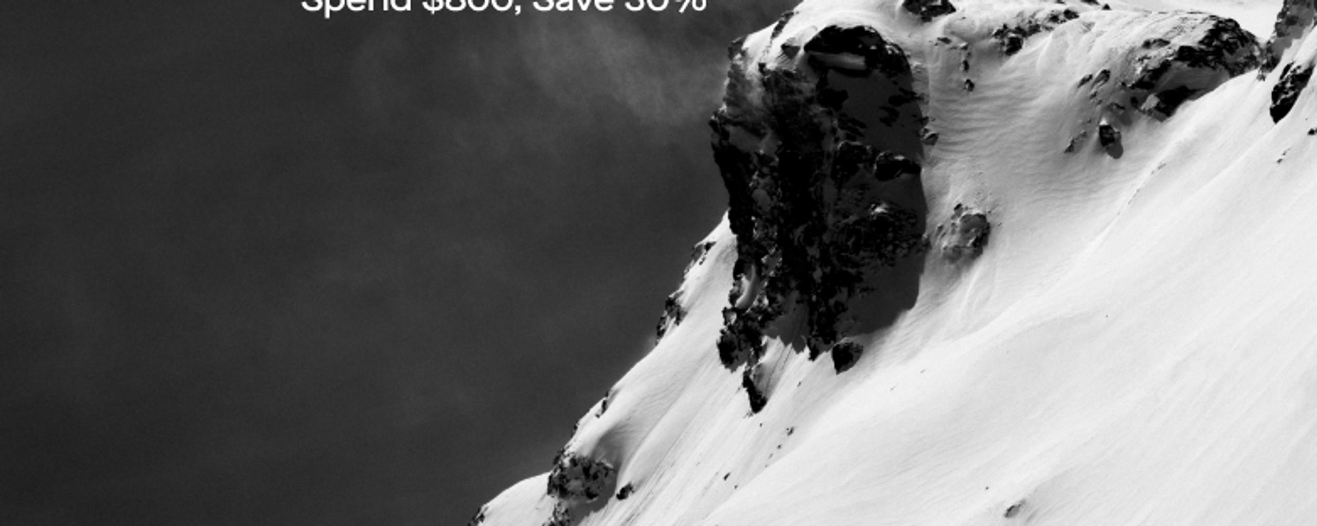 Black and white photo rock cliffs covered in snow
